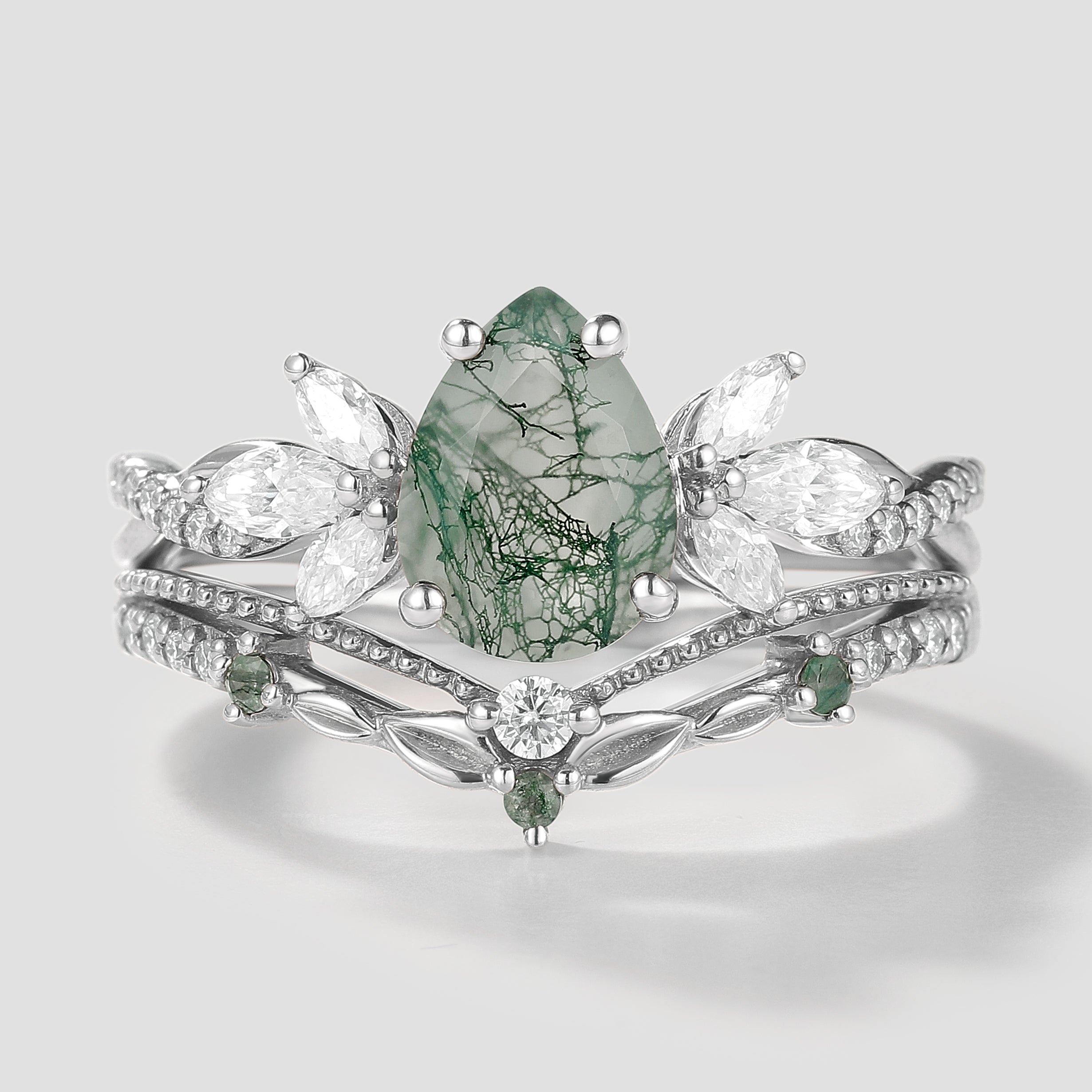 Nature-inspired pear cut moss agate ring set with leaf detailing