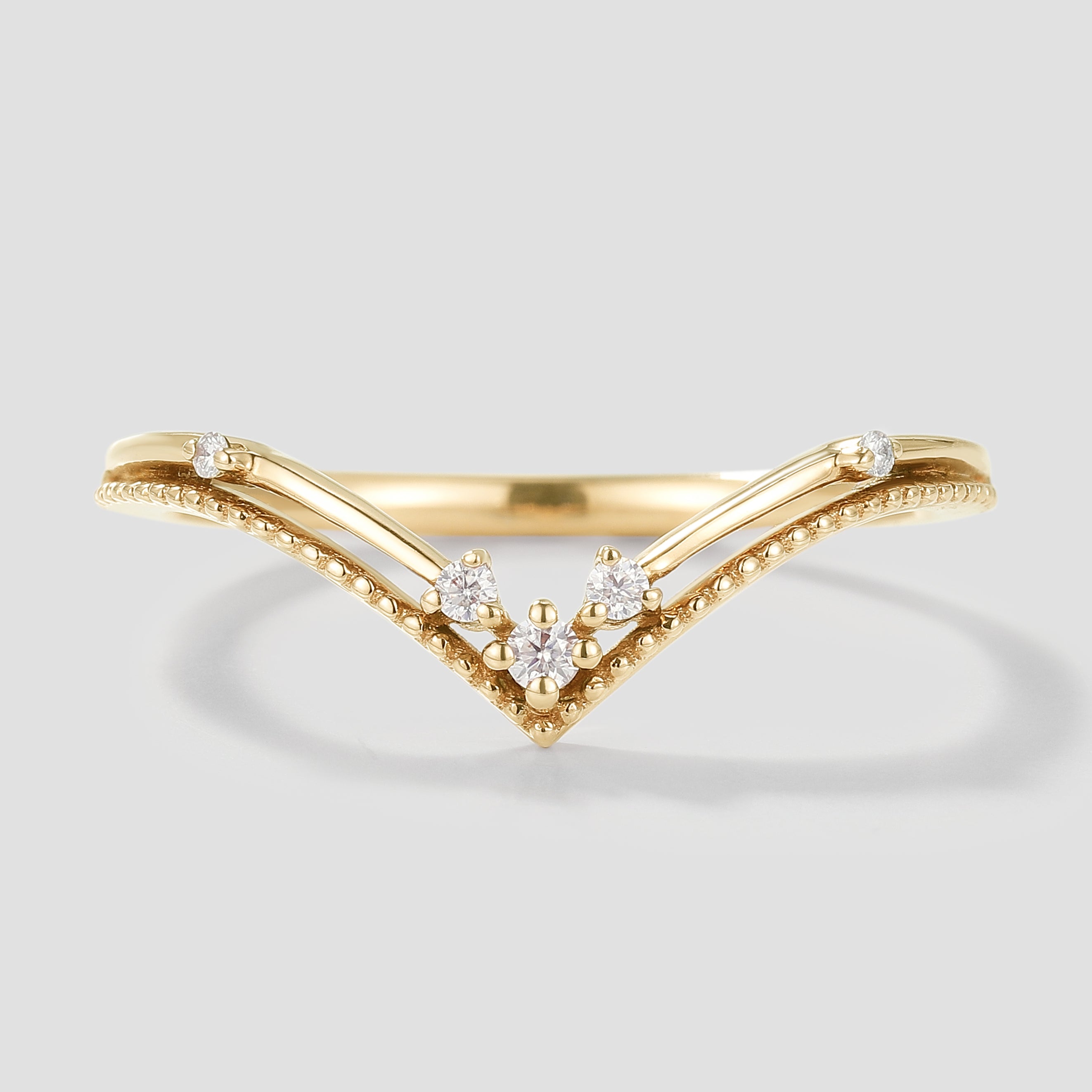 Elegant V-shaped moissanite wedding band in yellow gold