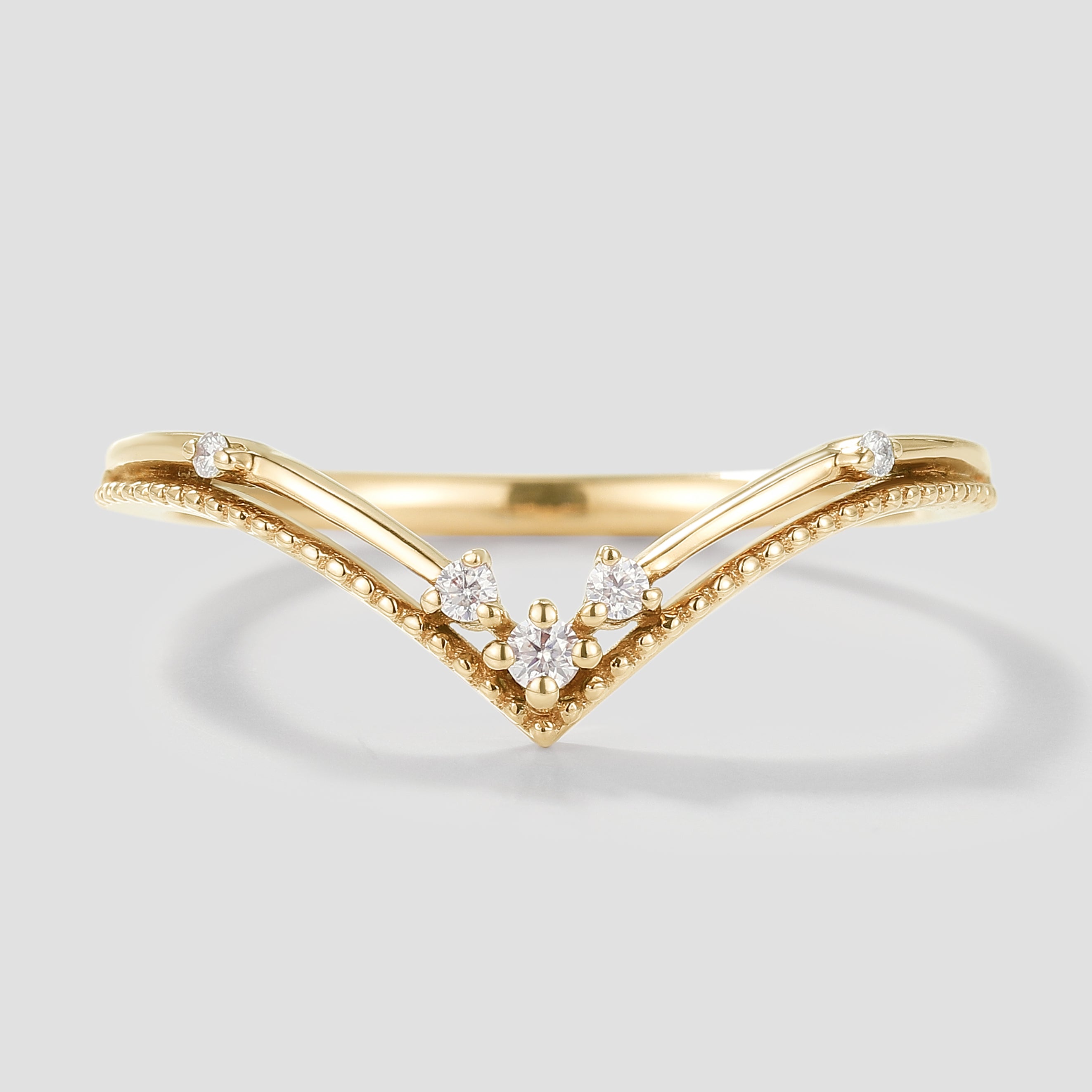 Elegant V-shaped moissanite wedding band in yellow gold