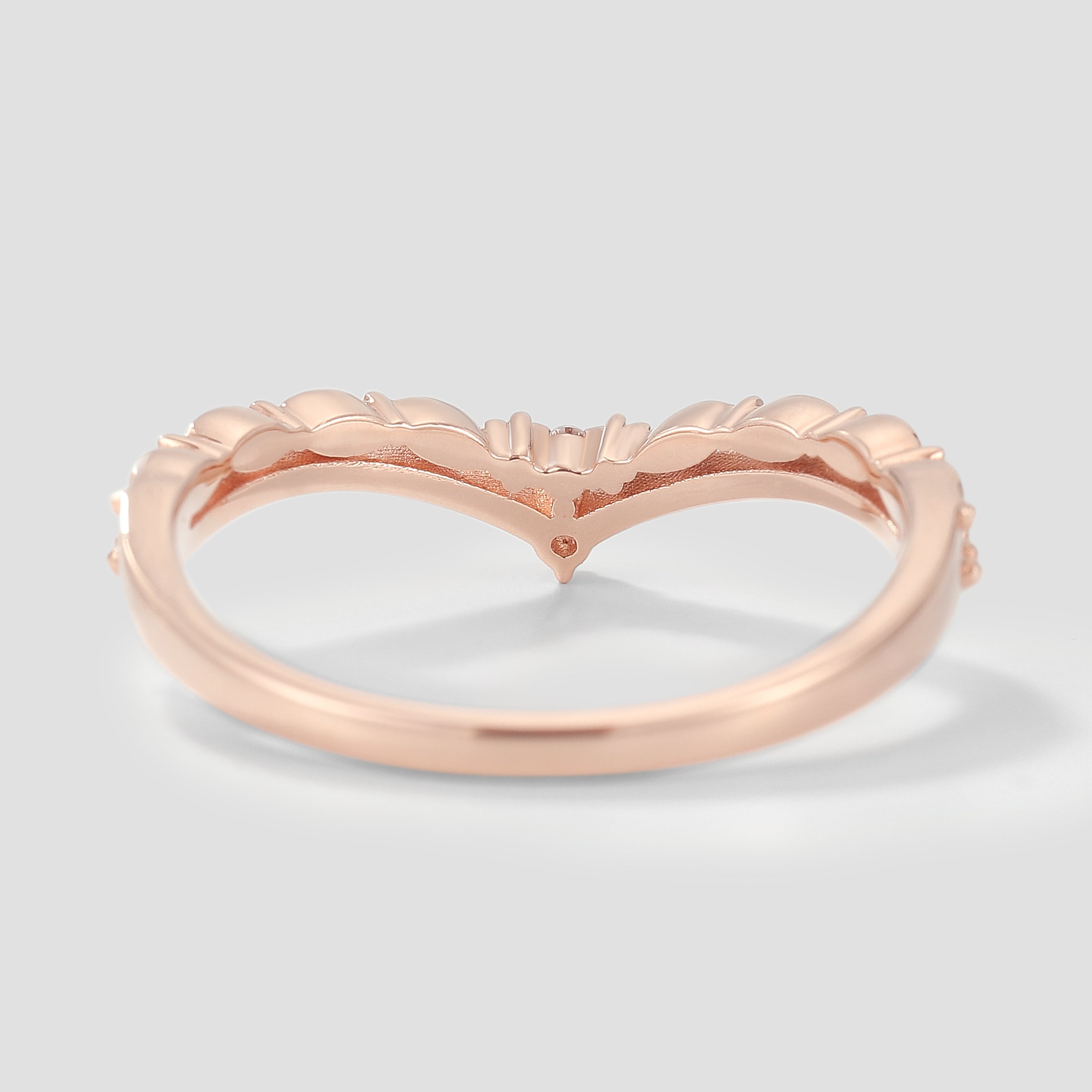 Rose gold V-shaped moissanite wedding band with leaf design