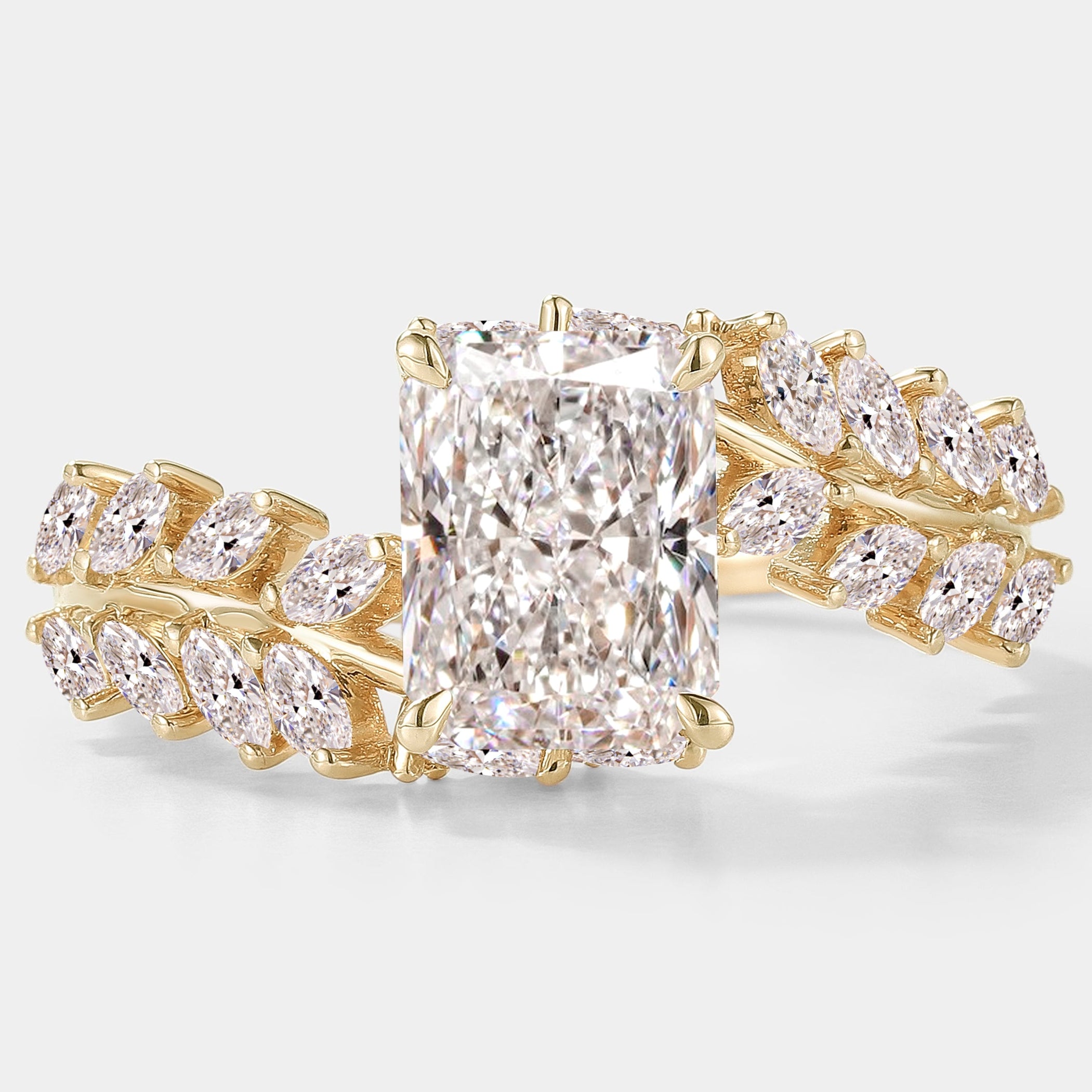 Nature-inspired emerald cut lab grown diamond ring with leaf detail