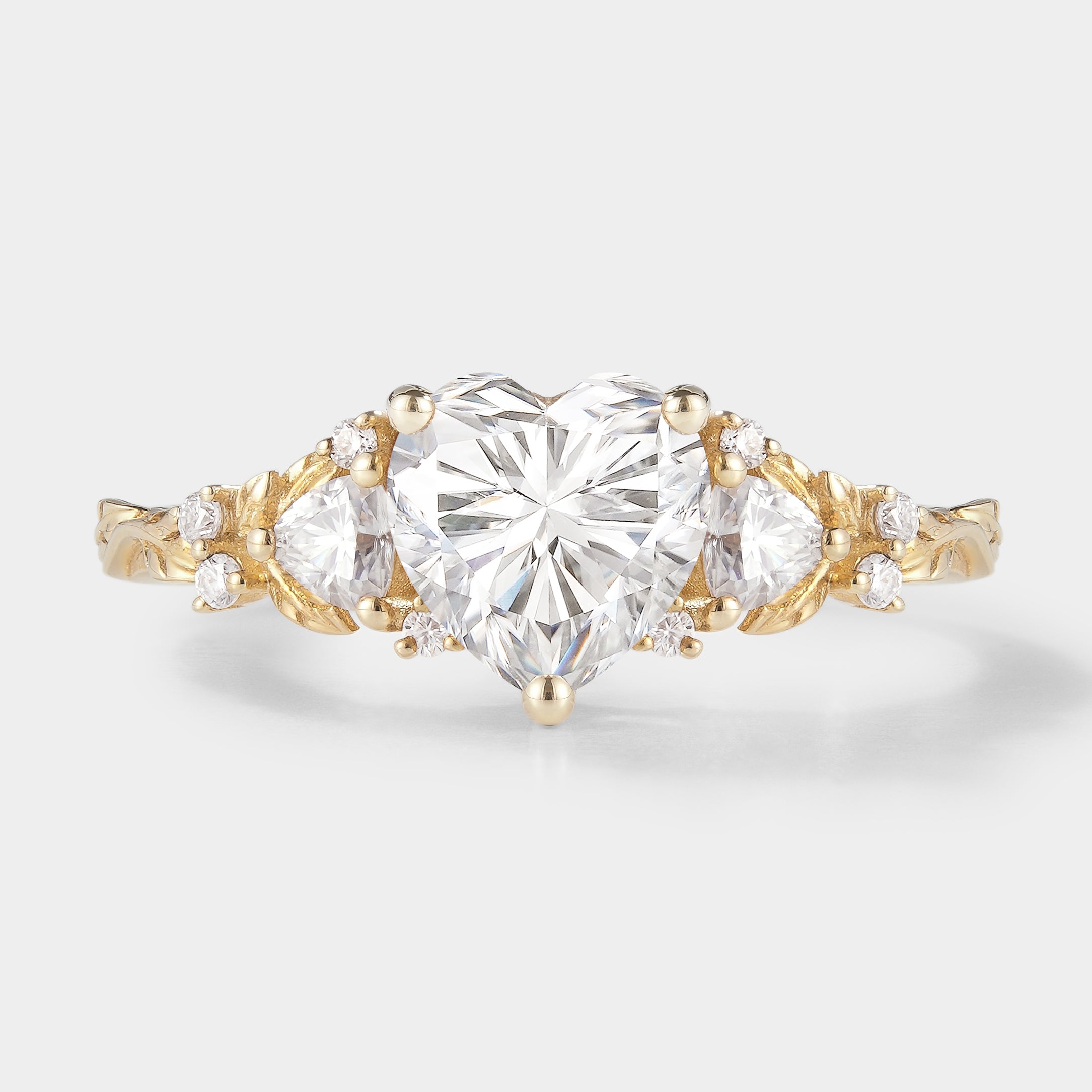 Heart-cut moissanite engagement ring with leaf design