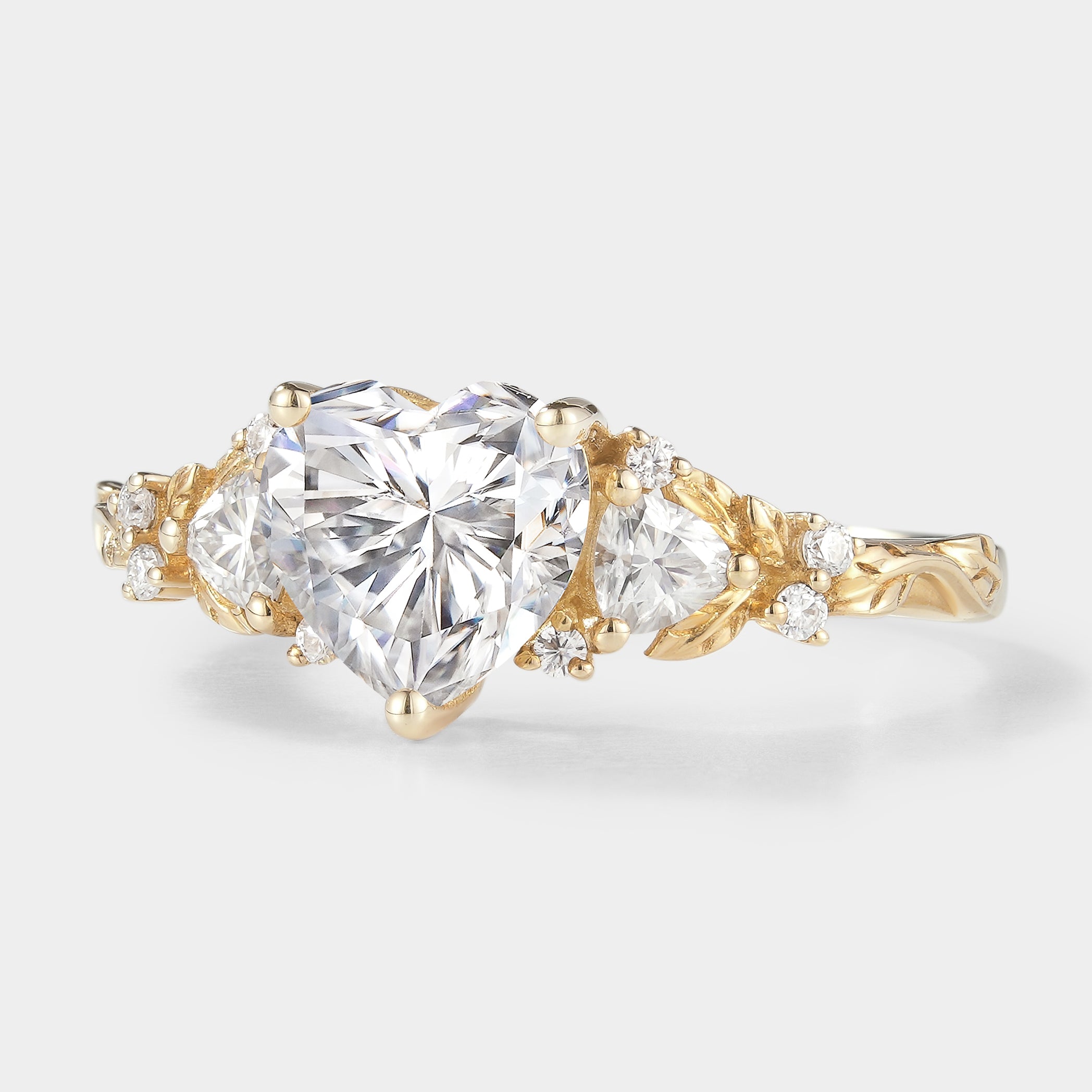Nature-inspired heart cut moissanite engagement ring with leaf details