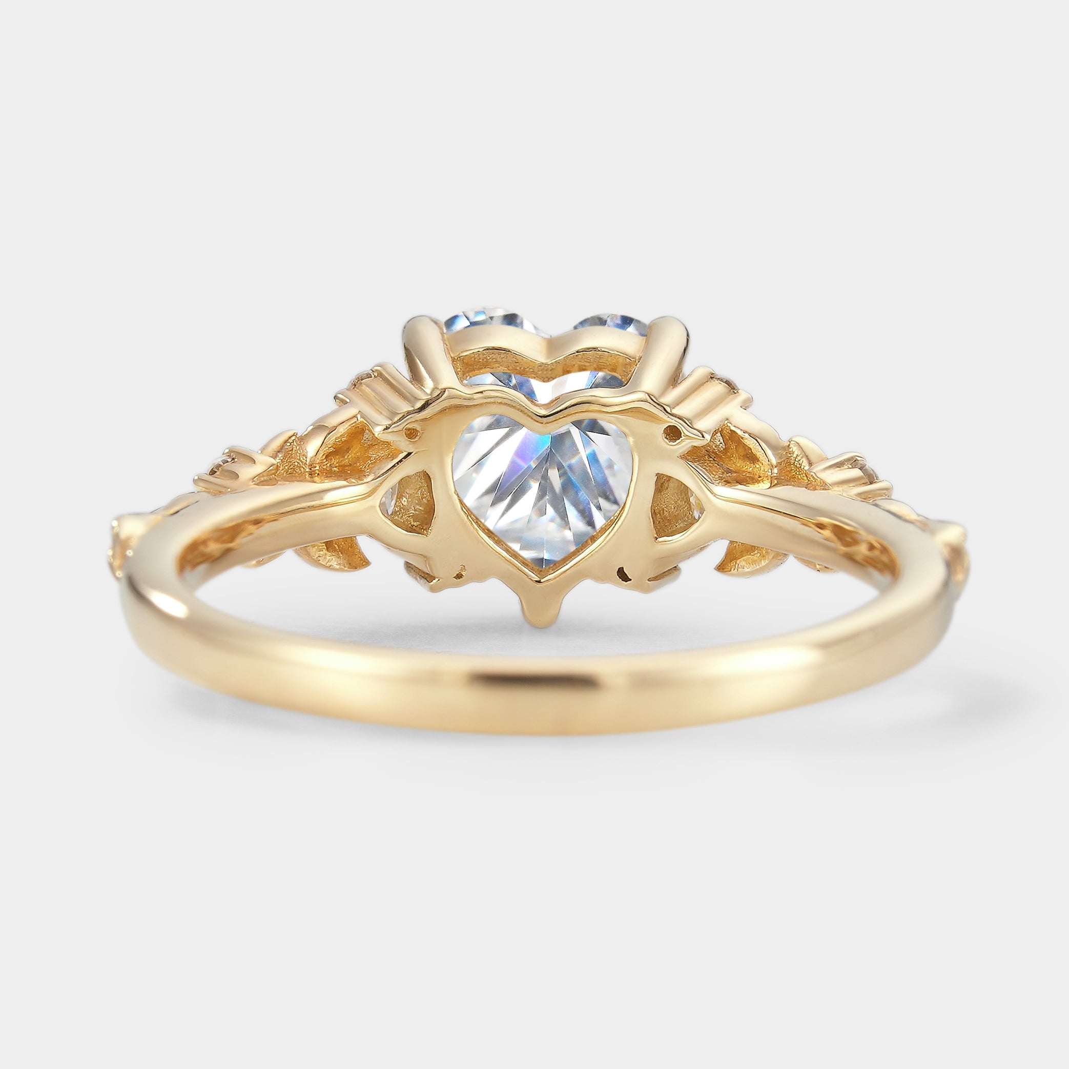 Nature-inspired heart-cut moissanite engagement ring with leaf details