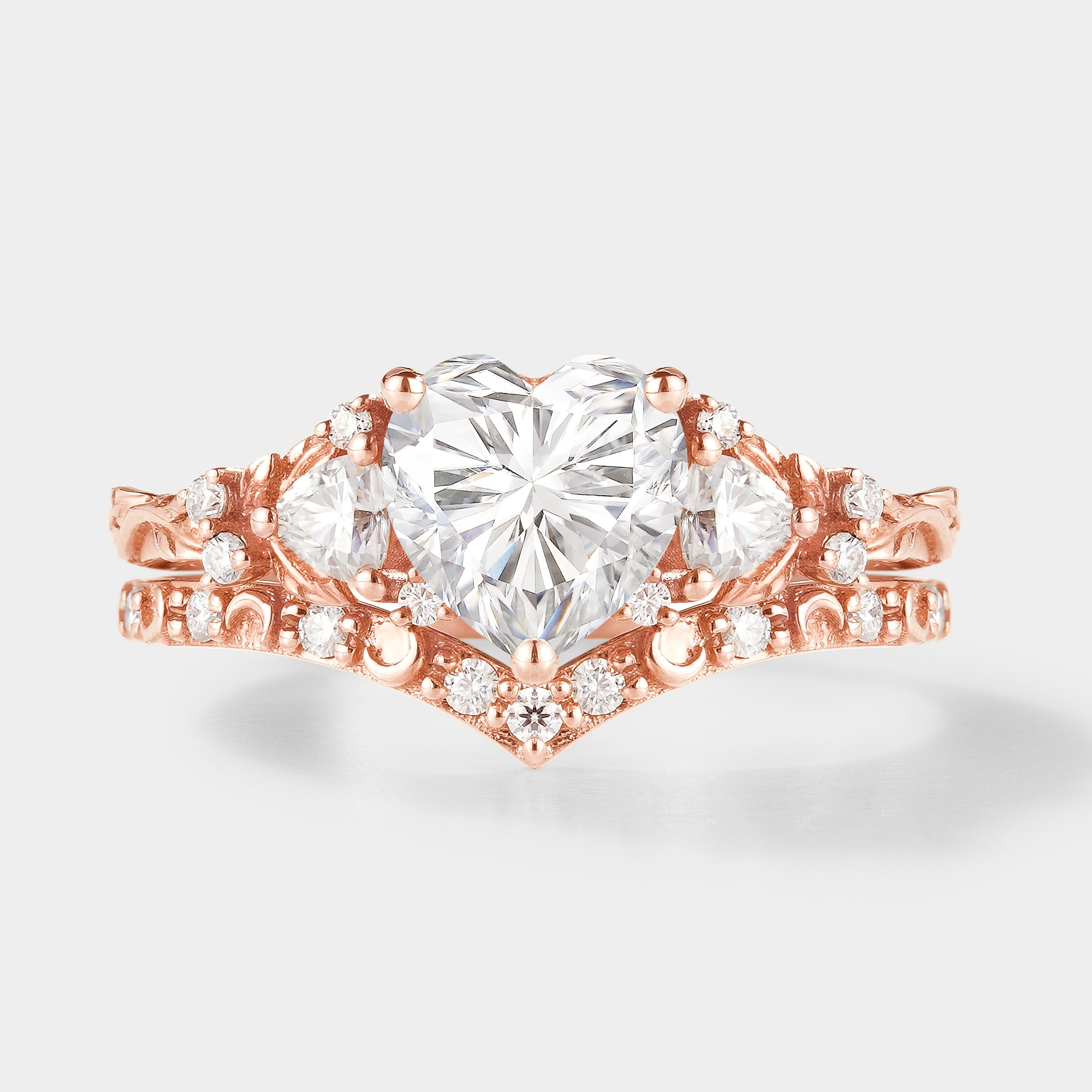 Rose gold heart-cut moissanite engagement ring and moon wedding band set