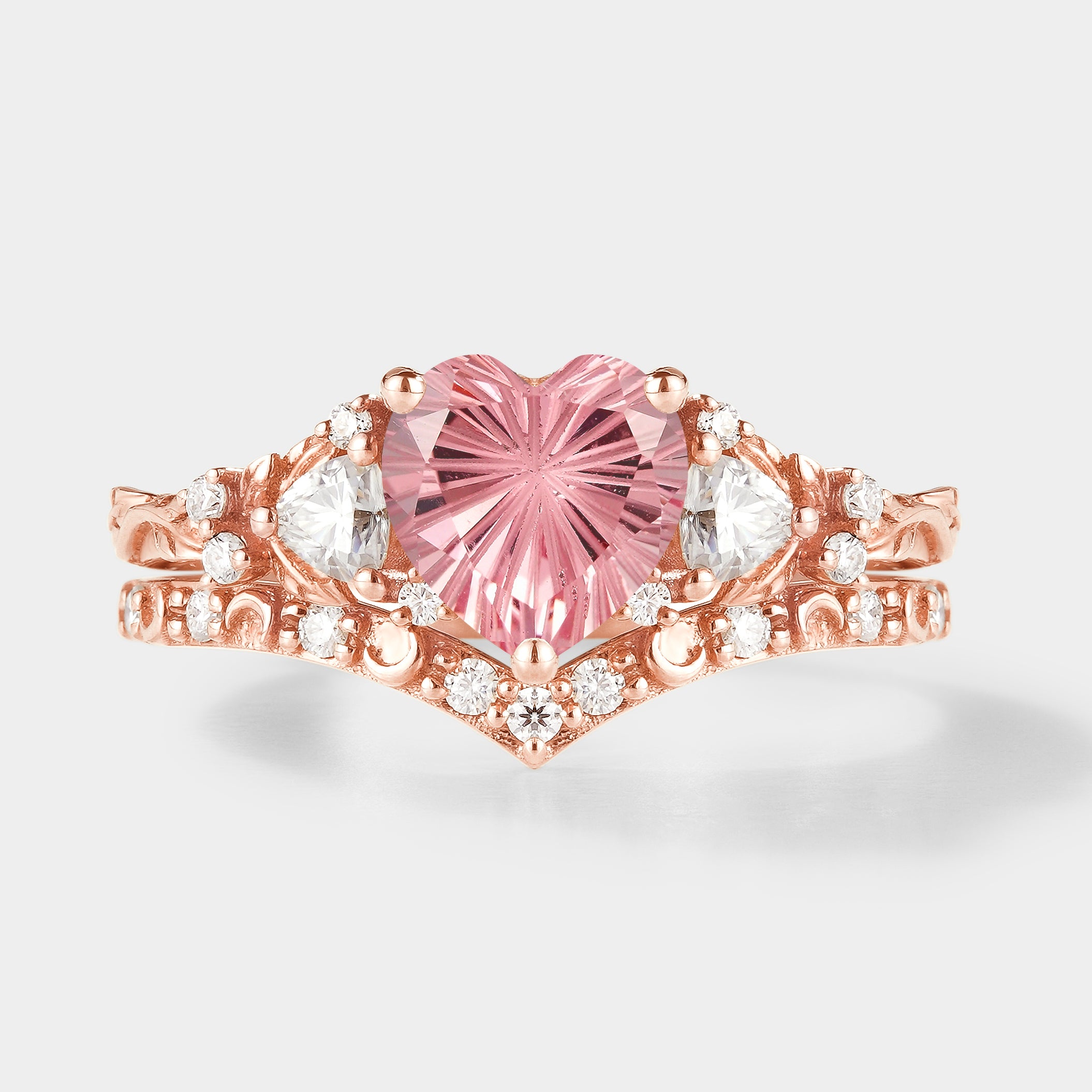 Rose gold heart cut Padparadscha engagement ring set with moissanite accents