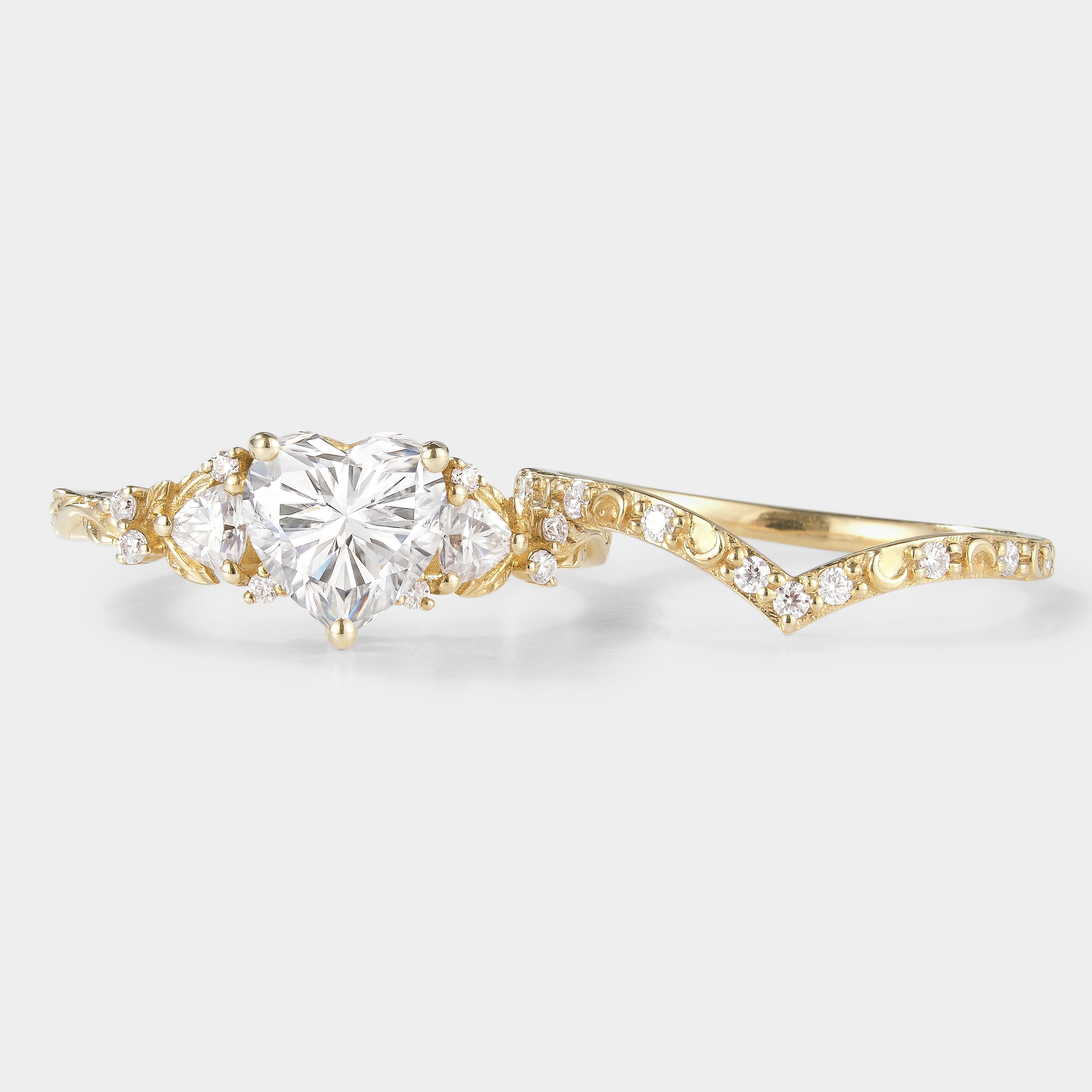 Heart-cut moissanite engagement ring set with moon wedding band