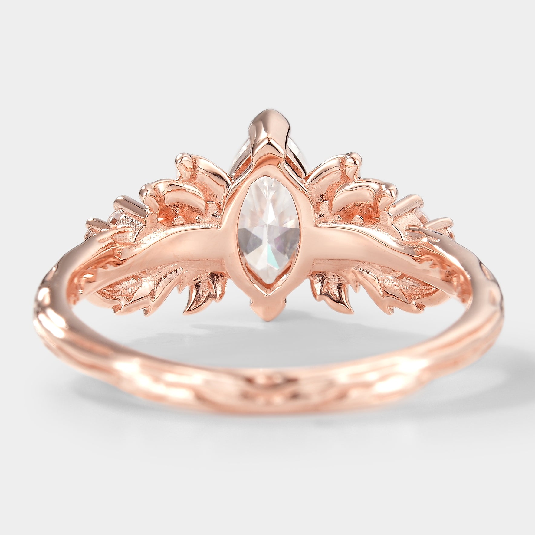 Rose gold leaf engagement ring with marquise moissanite