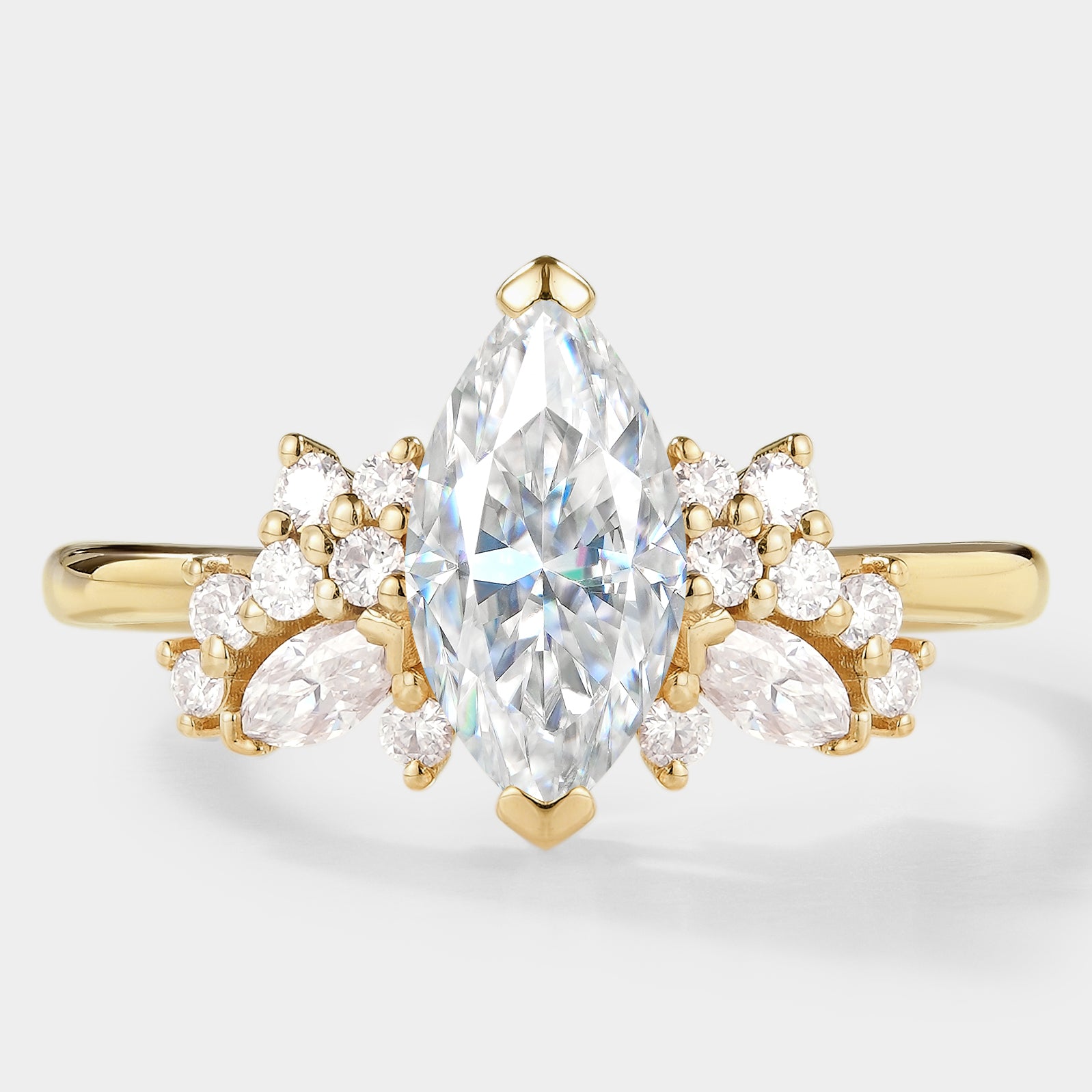Marquise moissanite cluster engagement ring, gold band.