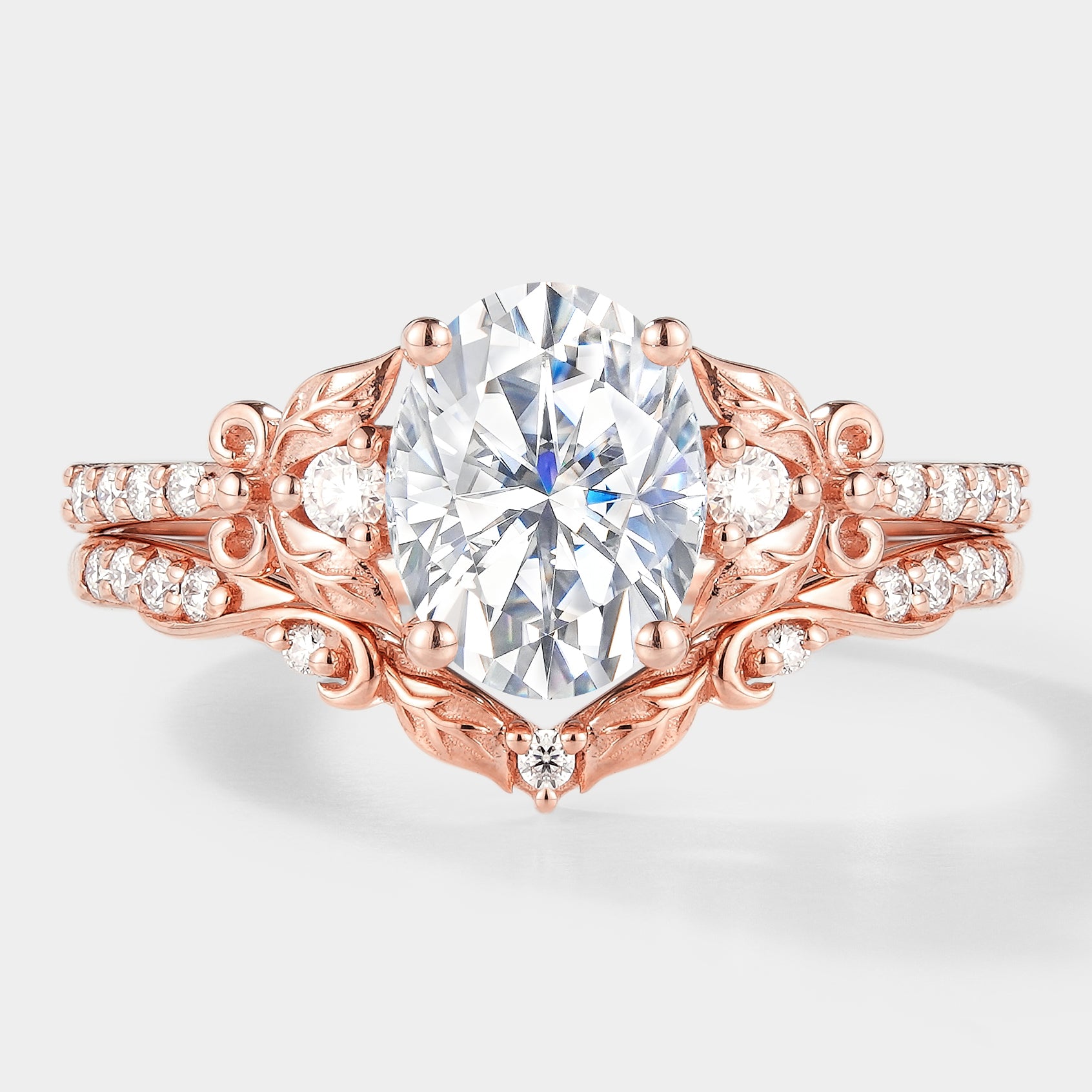 Oval cut moissanite leaf engagement ring set, rose gold
