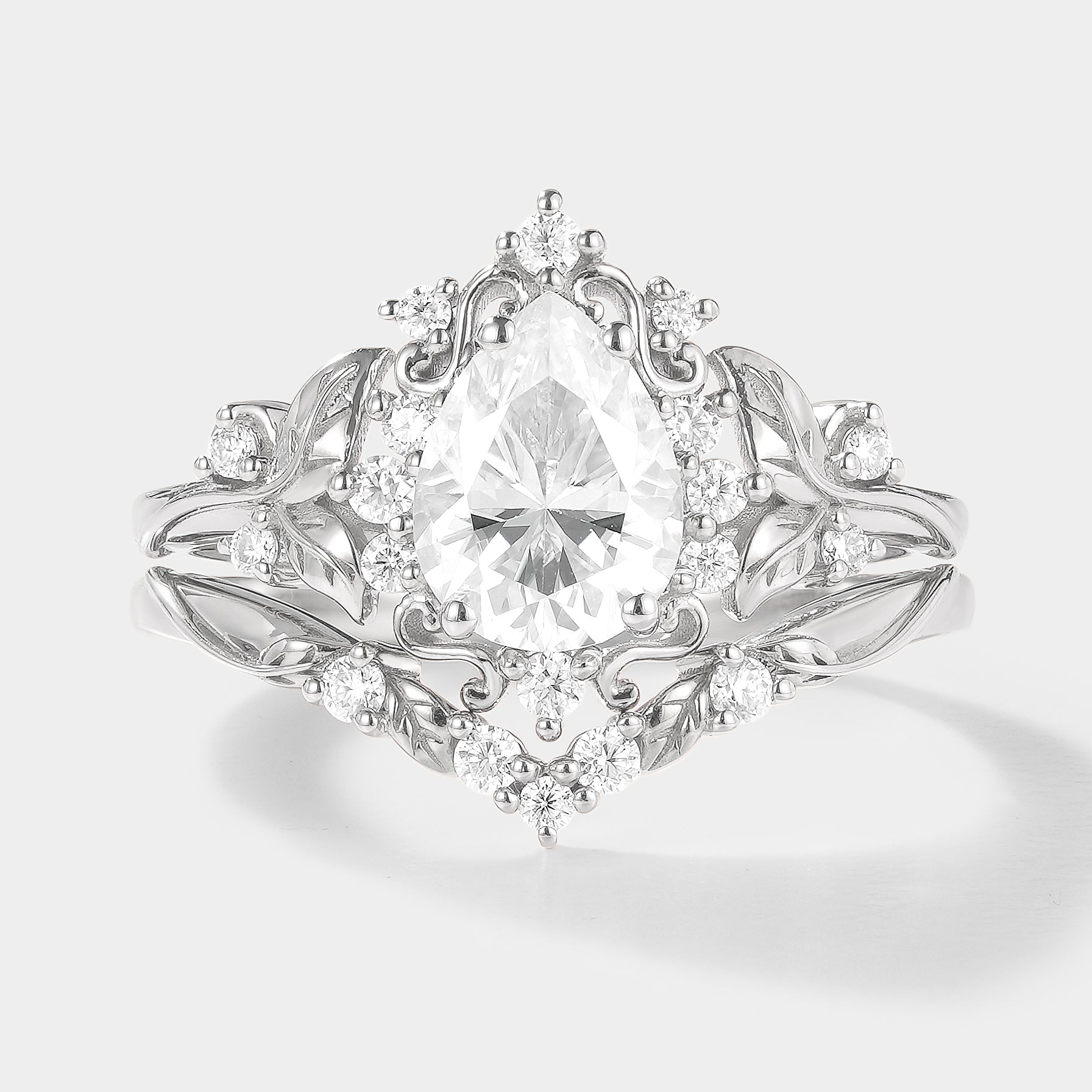 Leaf-inspired pear cut moissanite engagement ring set