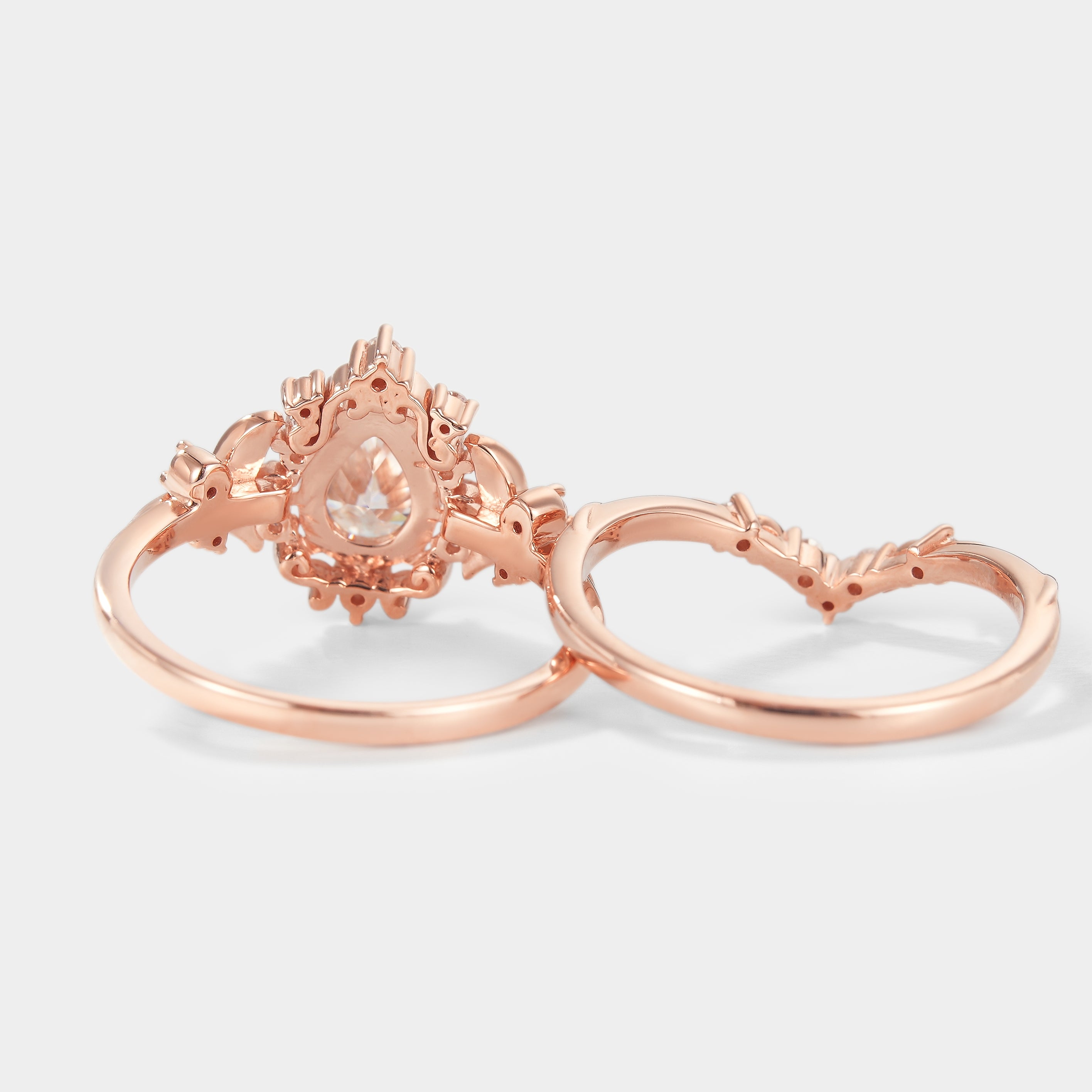 Rose gold pear cut moissanite engagement ring set, leaf design