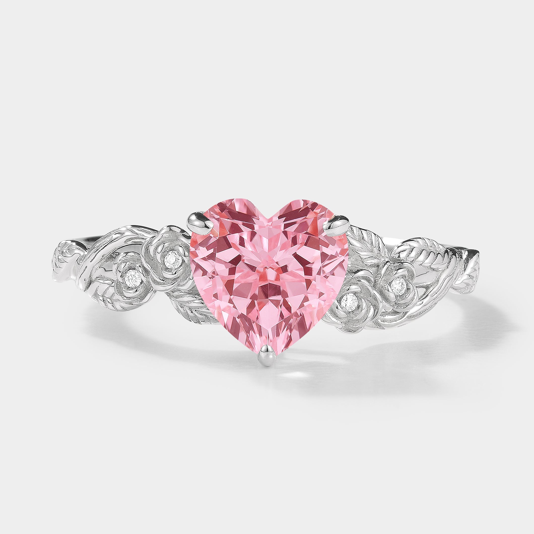 Nature-inspired Padparadscha sapphire engagement ring with leaf design