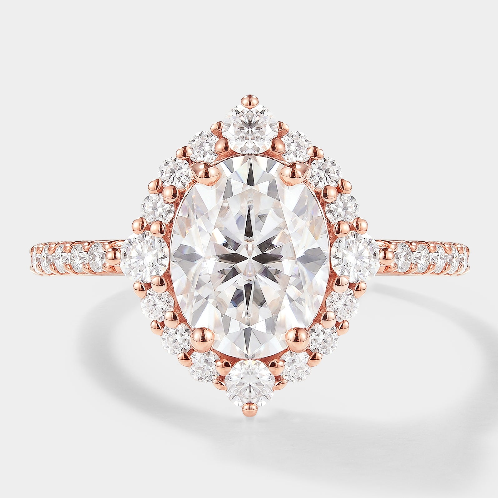 Oval Cut Moissanite Halo Engagement Ring in Rose Gold