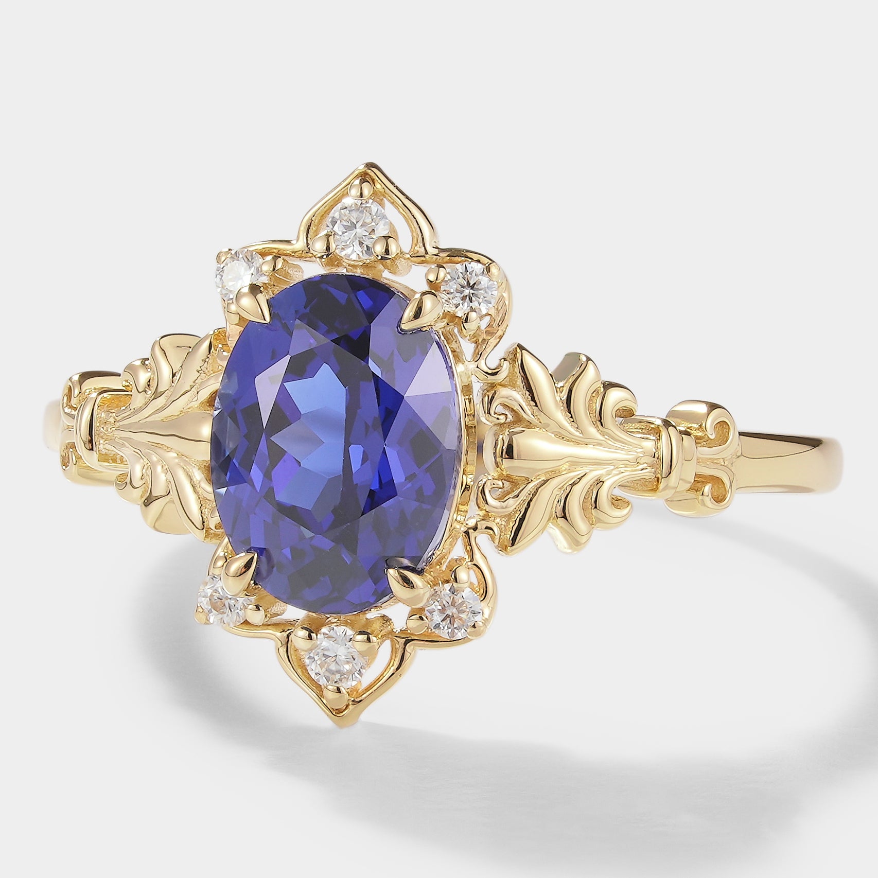 Oval Royal Blue Sapphire Engagement Ring with Floral Design