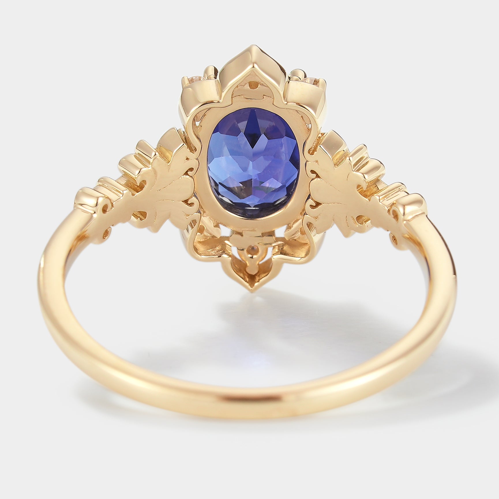 Royal blue sapphire engagement ring with iris details