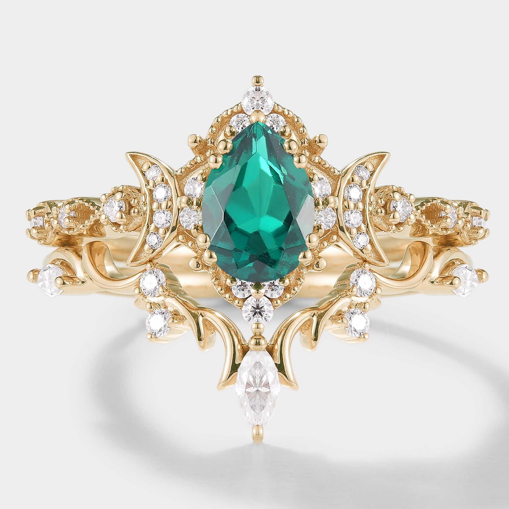 Emerald engagement ring set with moissanite, celestial design