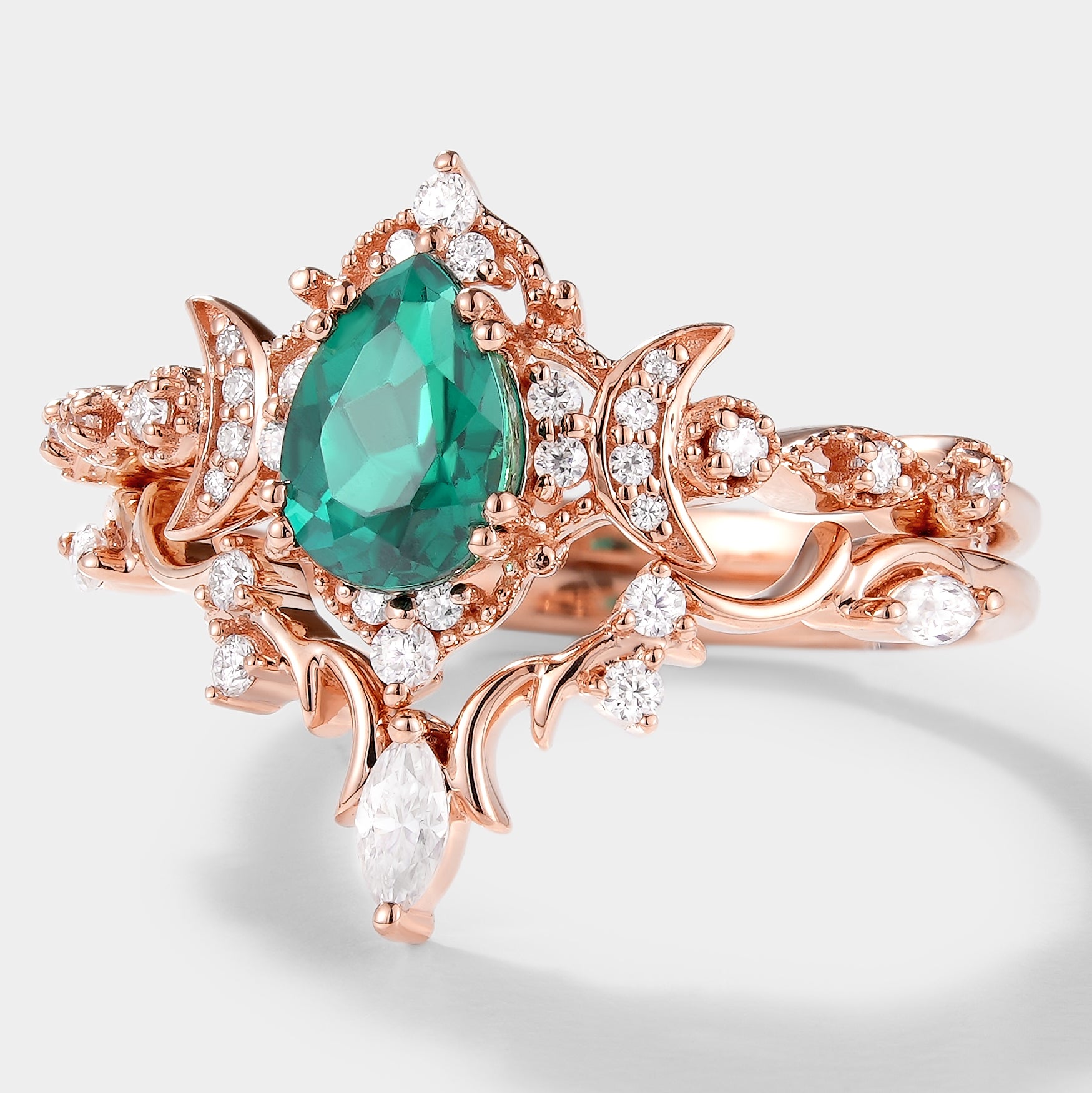 Rose gold emerald and moissanite ring set, moon shaped cluster