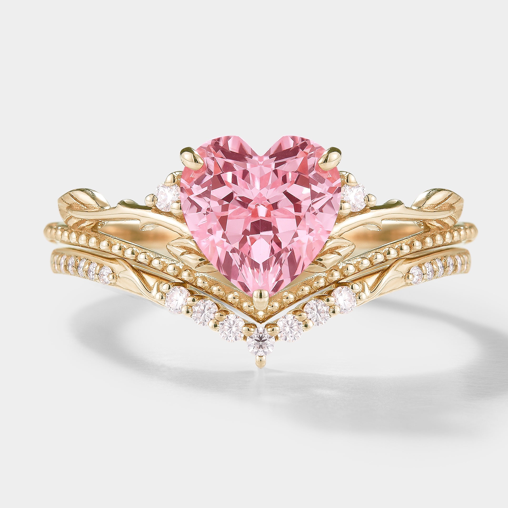 Heart-cut Padparadscha sapphire engagement ring set