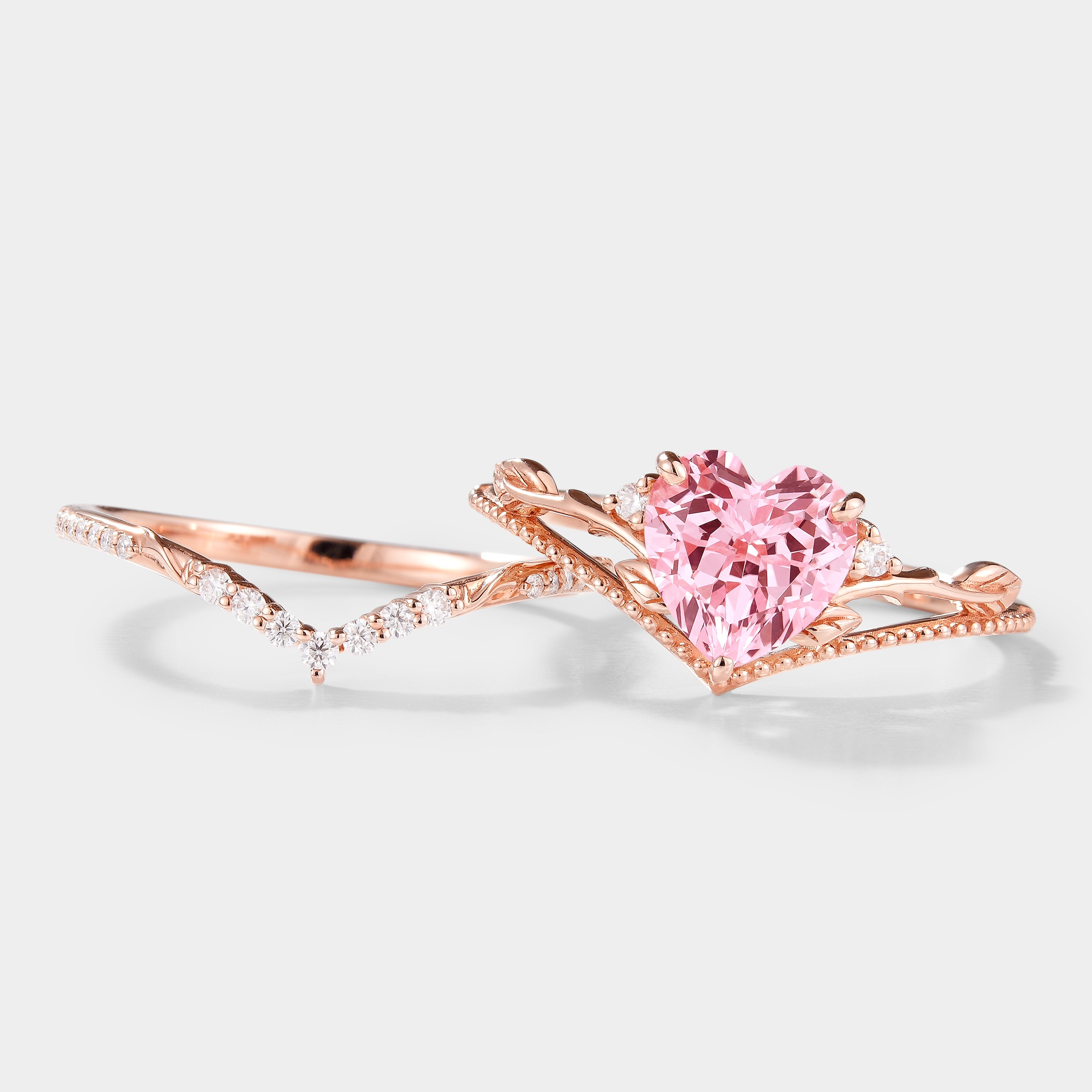Rose gold heart-cut Padparadscha sapphire engagement ring set