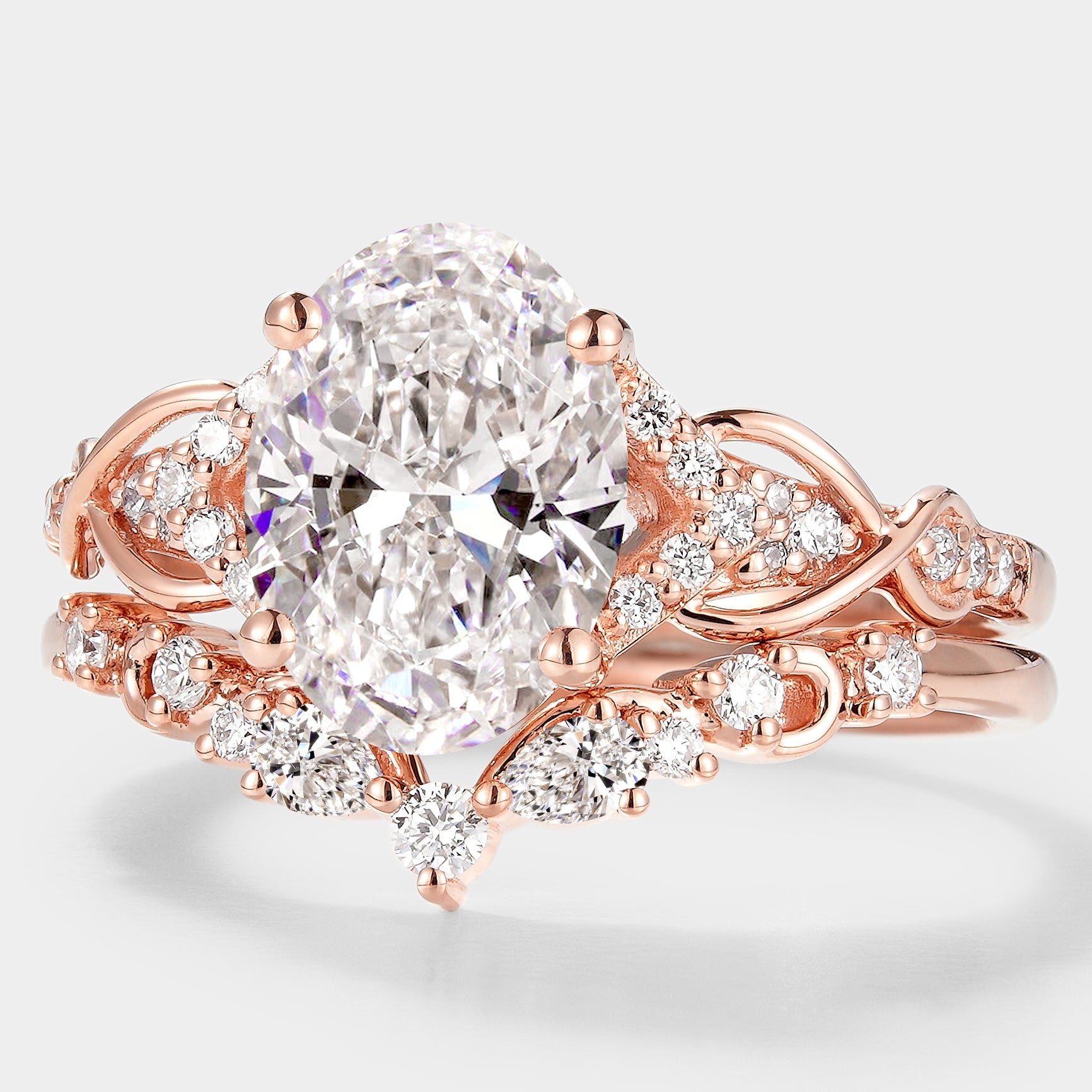 Oval cut lab grown diamond engagement ring with leaf design wedding band