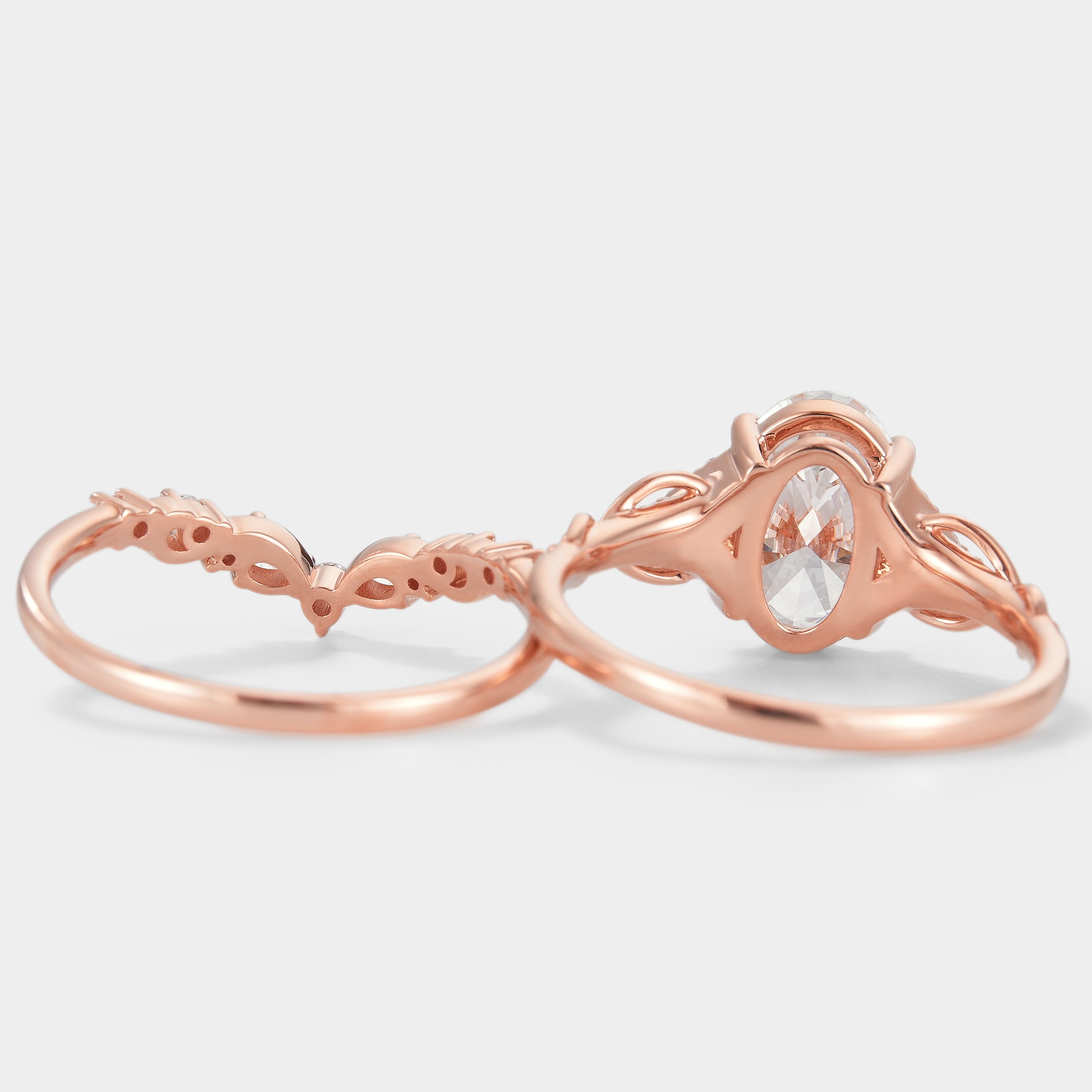 Rose gold oval cut diamond engagement ring and curved wedding band