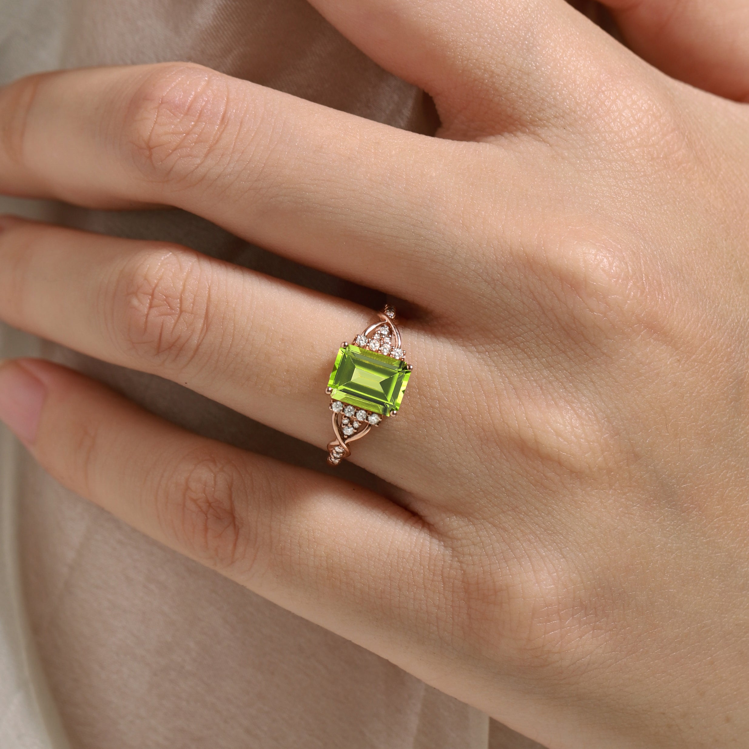 Emerald cut peridot engagement ring in rose gold, featuring moissanite accents, vintage design, handmade