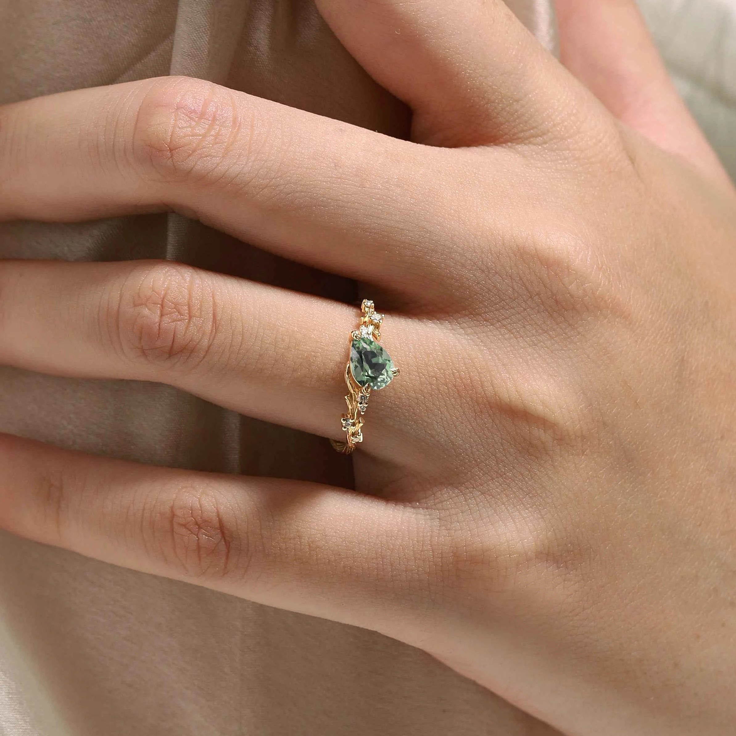 Branch & Leaf Prong Unique Tilted Pear-Cut Teal Sapphire Engagement Ring