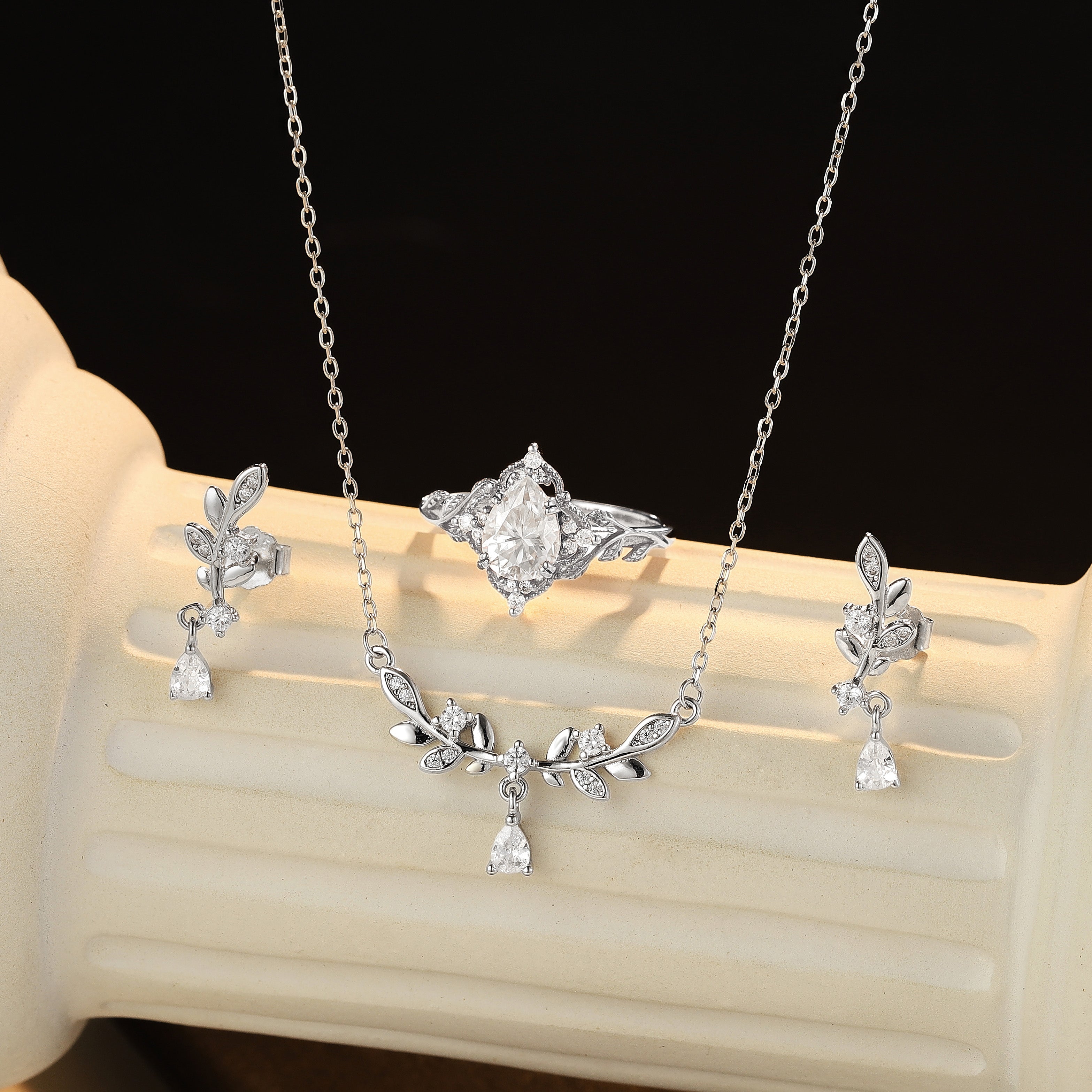 Leaf Motif Jewelry Set with ring, earrings, and necklace.