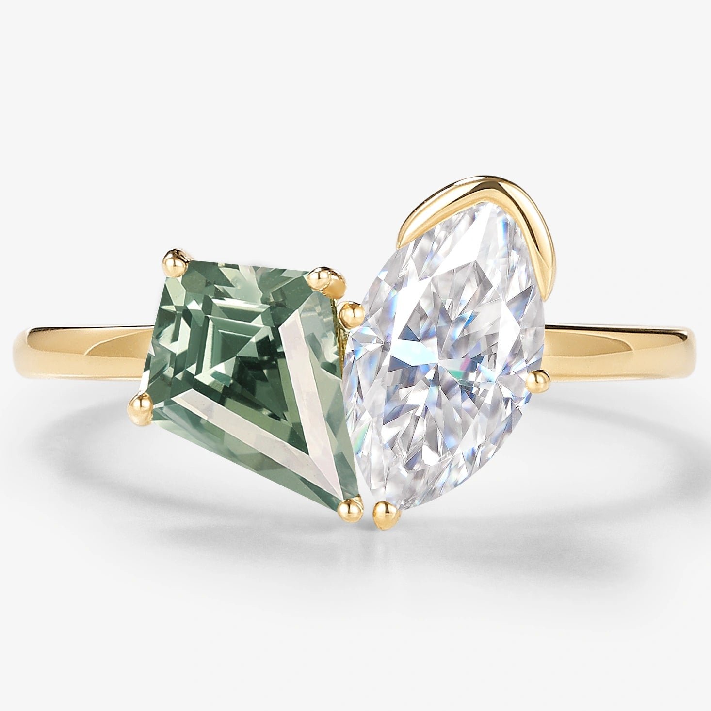 Green sapphire and moissanite engagement ring in yellow gold. Kite cut green sapphire and marquise moissanite.