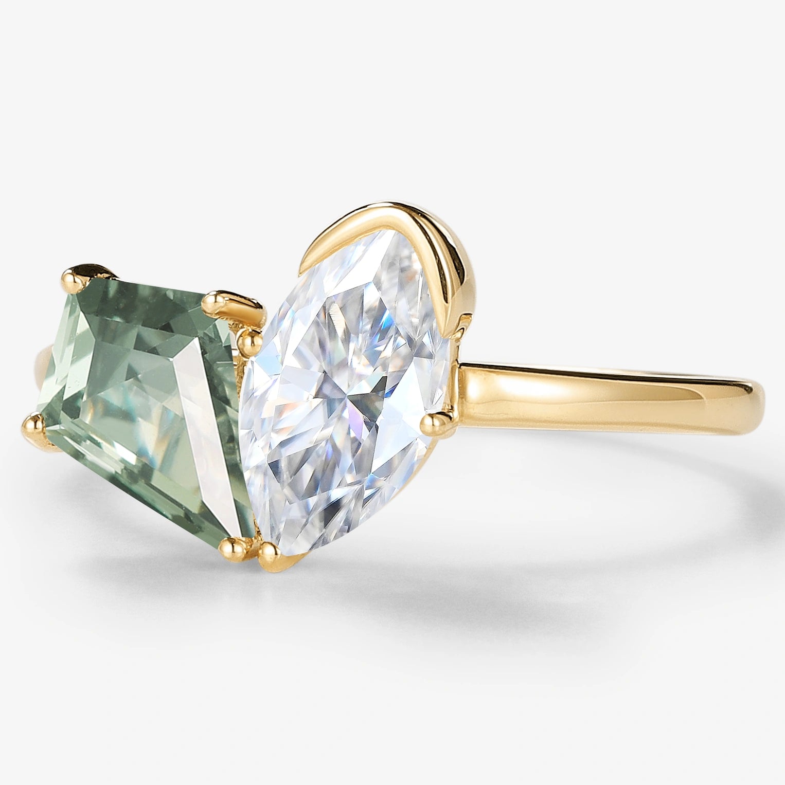 Kite-cut green sapphire and marquise moissanite engagement ring in yellow gold. Lahela Jewelry.