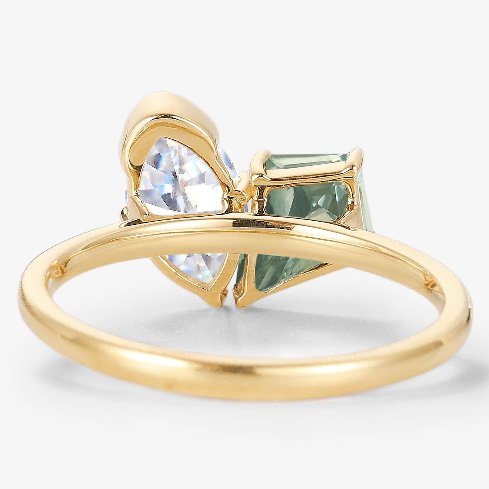 Yellow gold engagement ring with kite cut green sapphire and marquise moissanite. Lahela Jewelry.