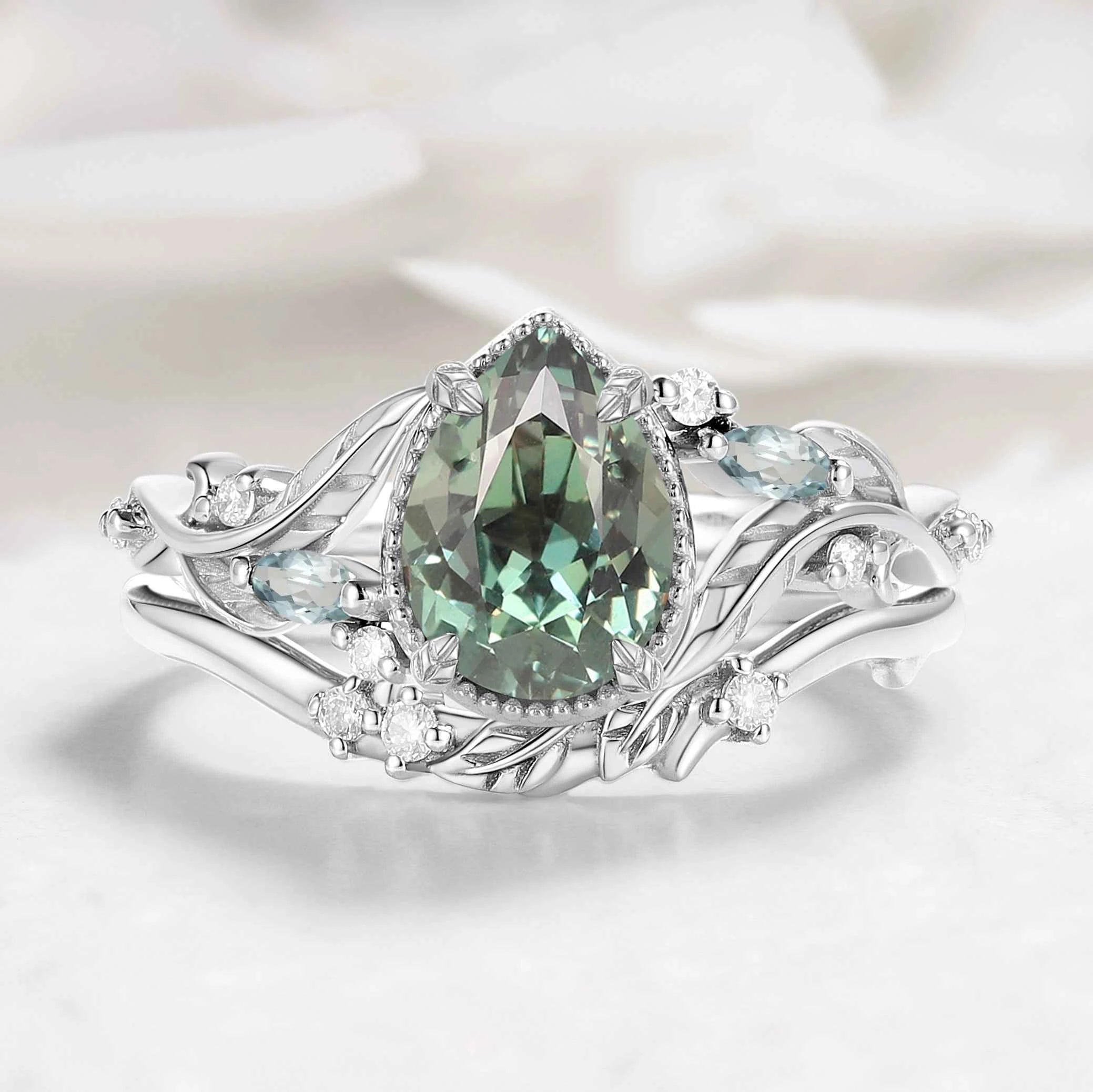 Nature-Inspired Leaf Vintage Bezel Pear Cut Green Sapphire Bridal Set