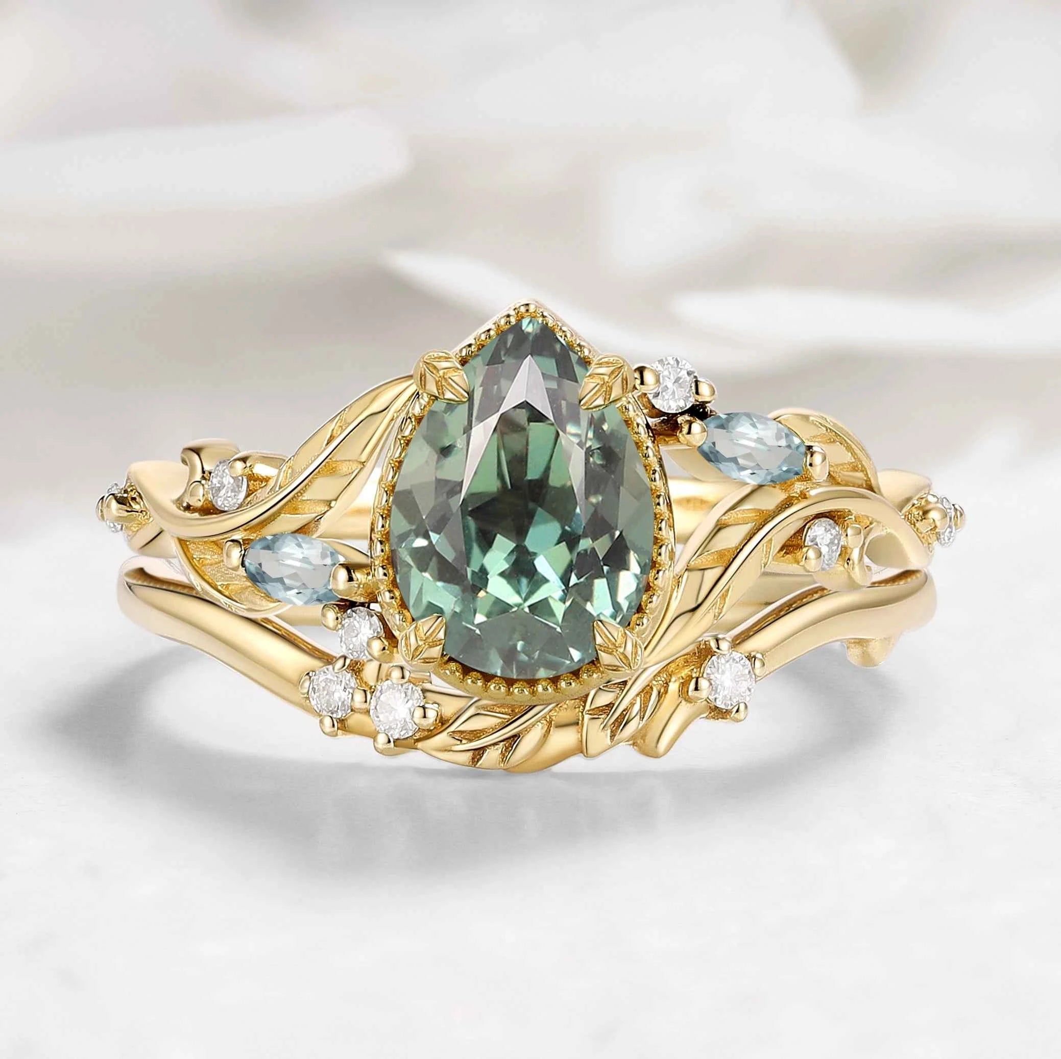 Nature-Inspired Leaf Vintage Bezel Pear Cut Green Sapphire Bridal Set