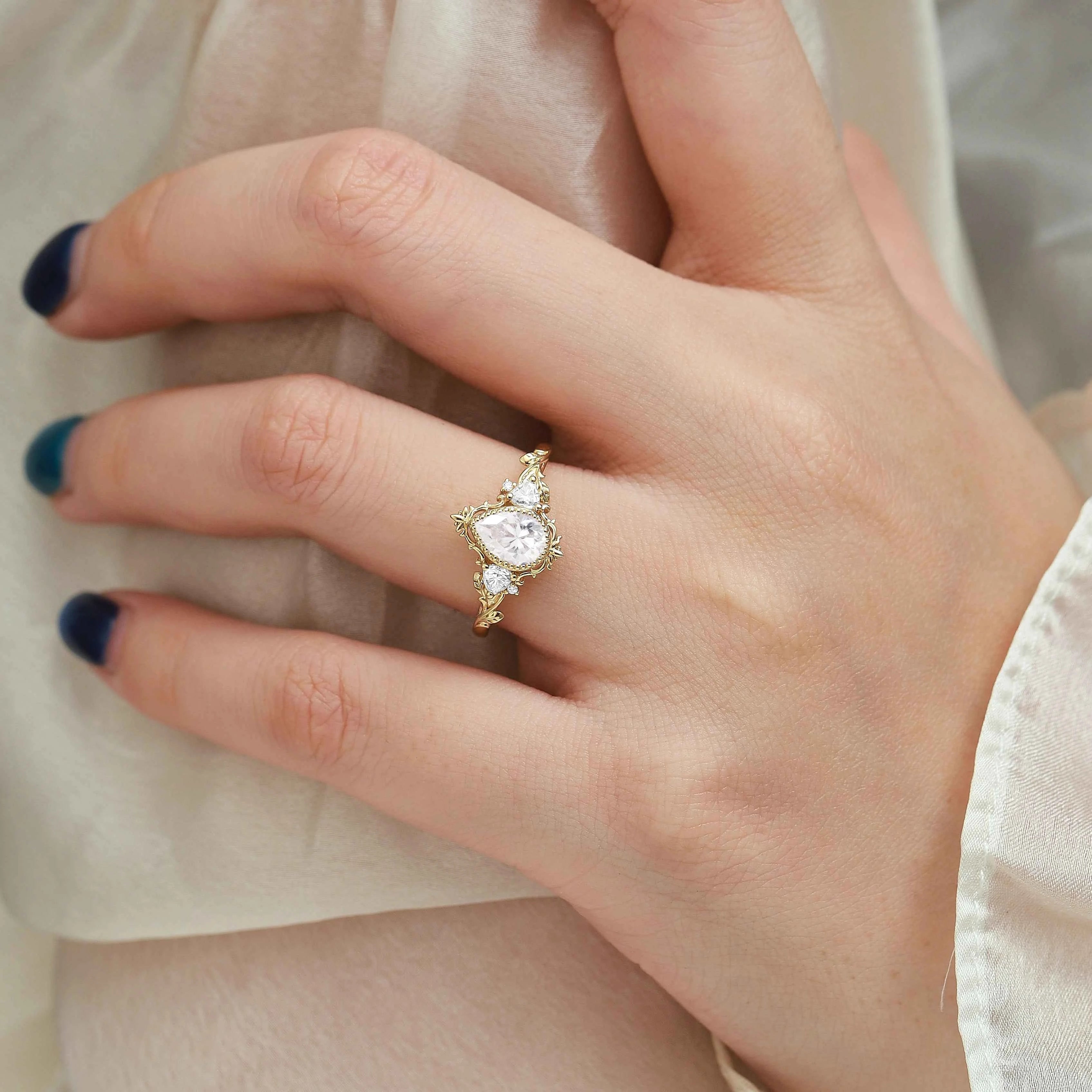 Nature-Inspired Pear Cut Moissanite Bezel Engagement Ring with Trillion Accent Stones - Emily