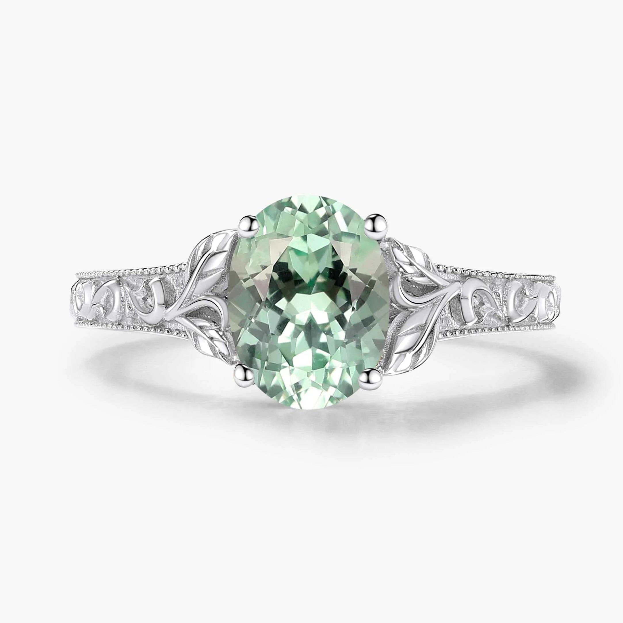 Oval-Cut Green Sapphire Engagement Ring with Leaf-Embraced Band