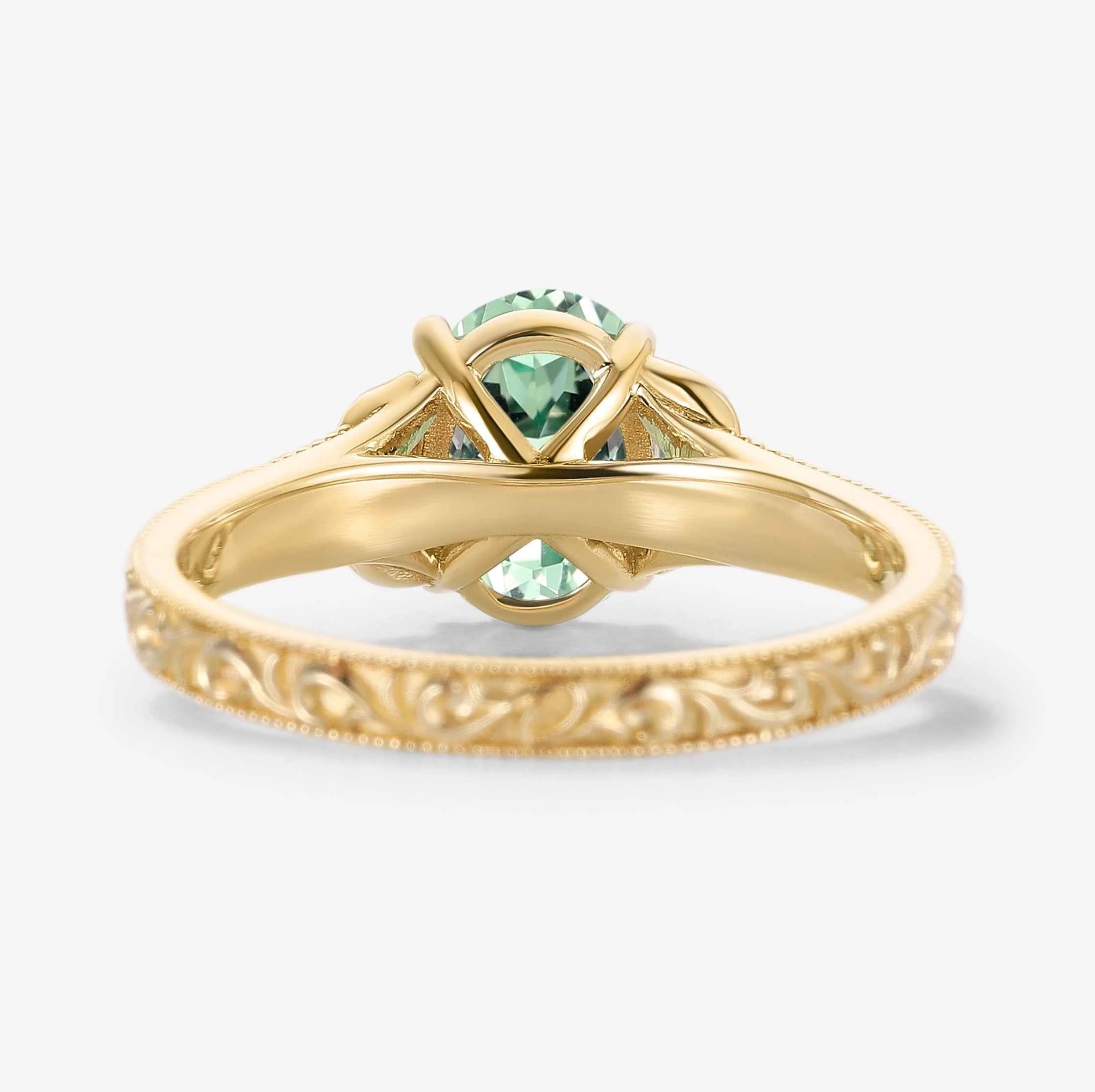 Oval-Cut Green Sapphire Engagement Ring with Leaf-Embraced Band