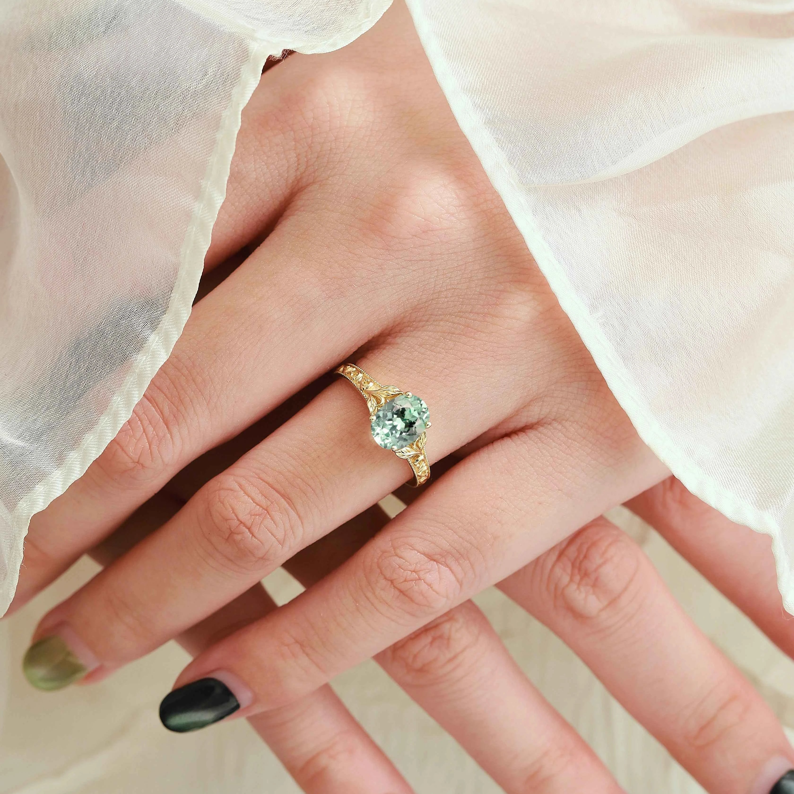 Oval-Cut Green Sapphire Engagement Ring with Leaf-Embraced Band