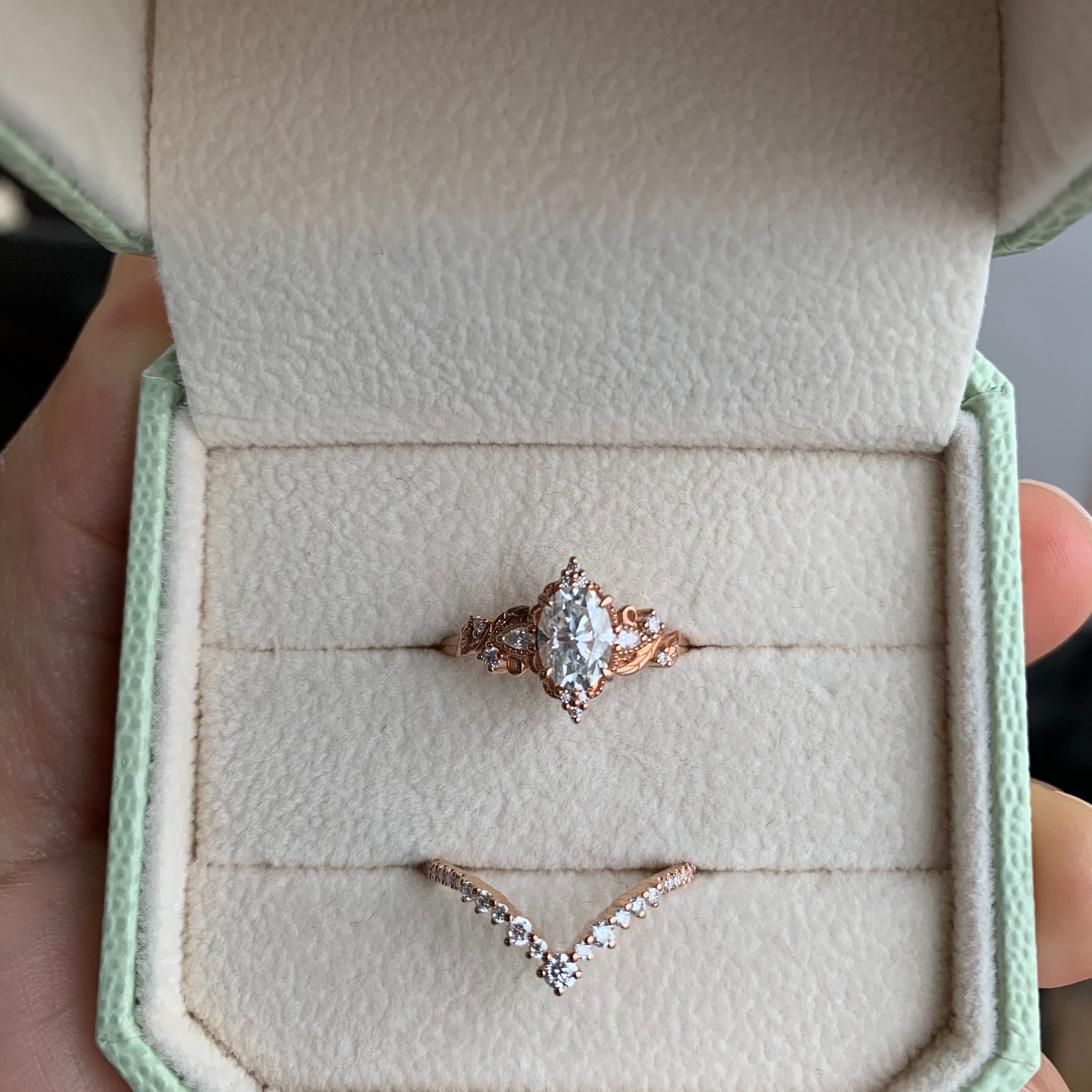 Oval cut moissanite engagement ring set in a jewelry box