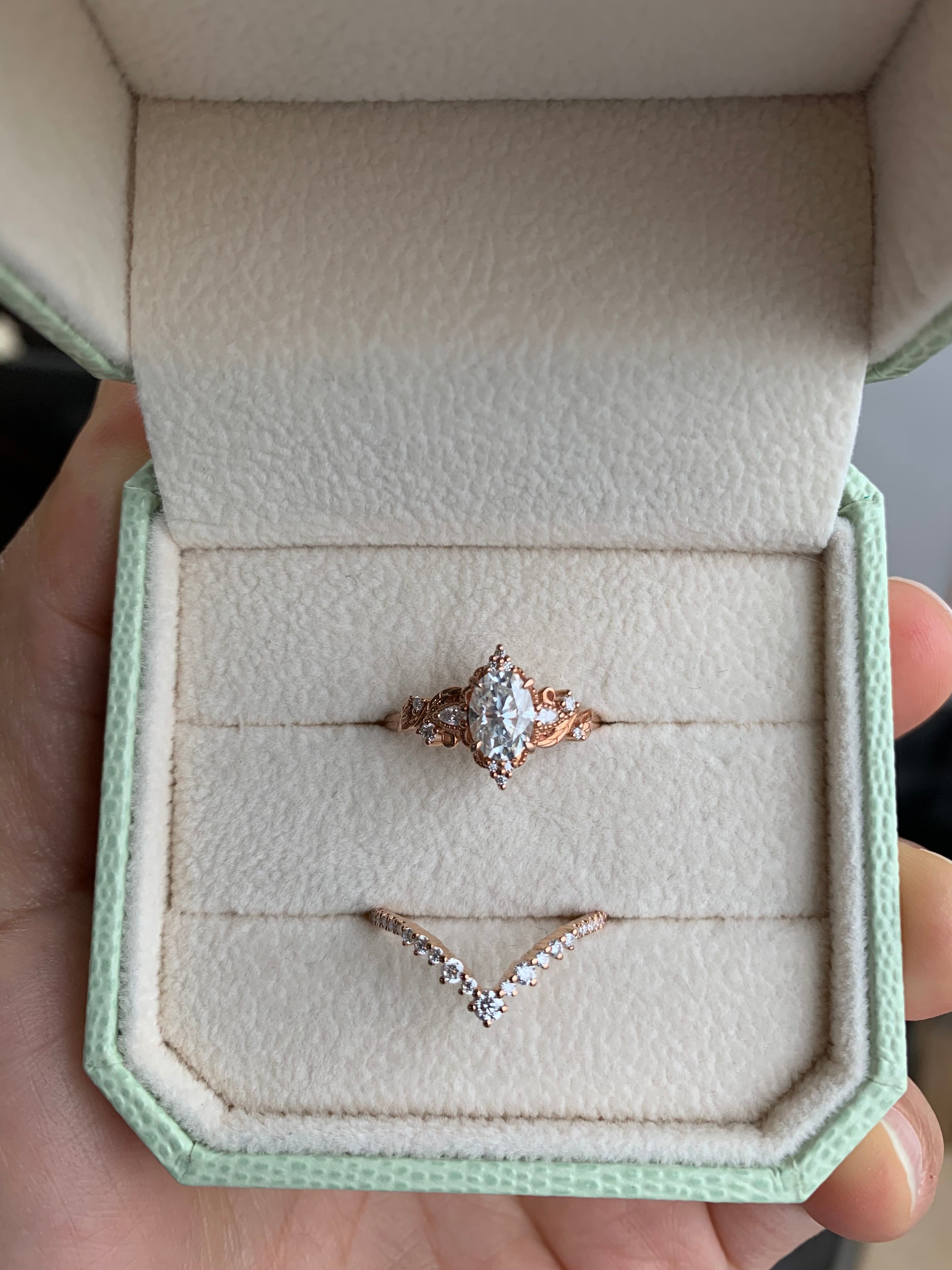 Oval cut moissanite engagement ring set in a jewelry box