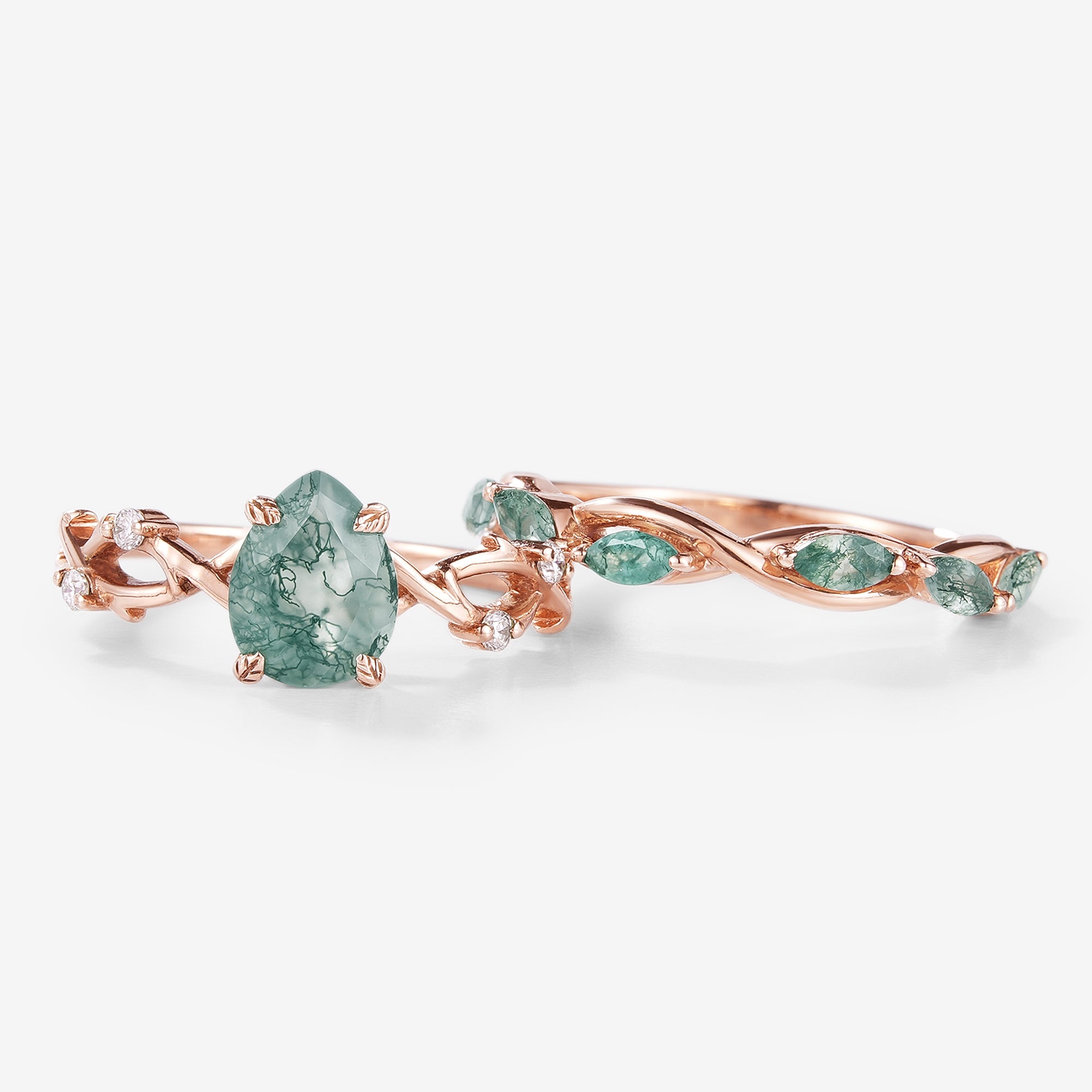 Rose gold moss agate engagement ring set with pear-cut center stone and wedding band. Bridal ring set.