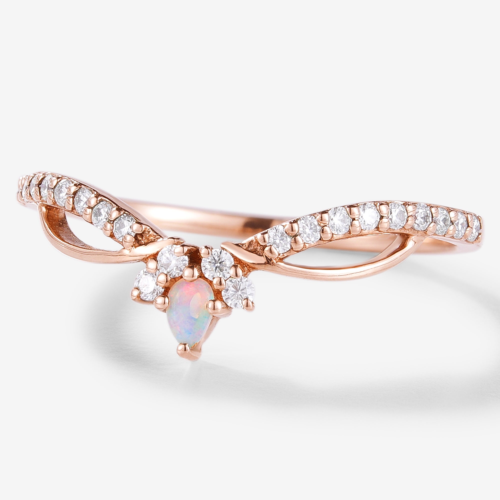 Rose gold stacking wedding band with opal and moissanite. Vintage engagement ring design.