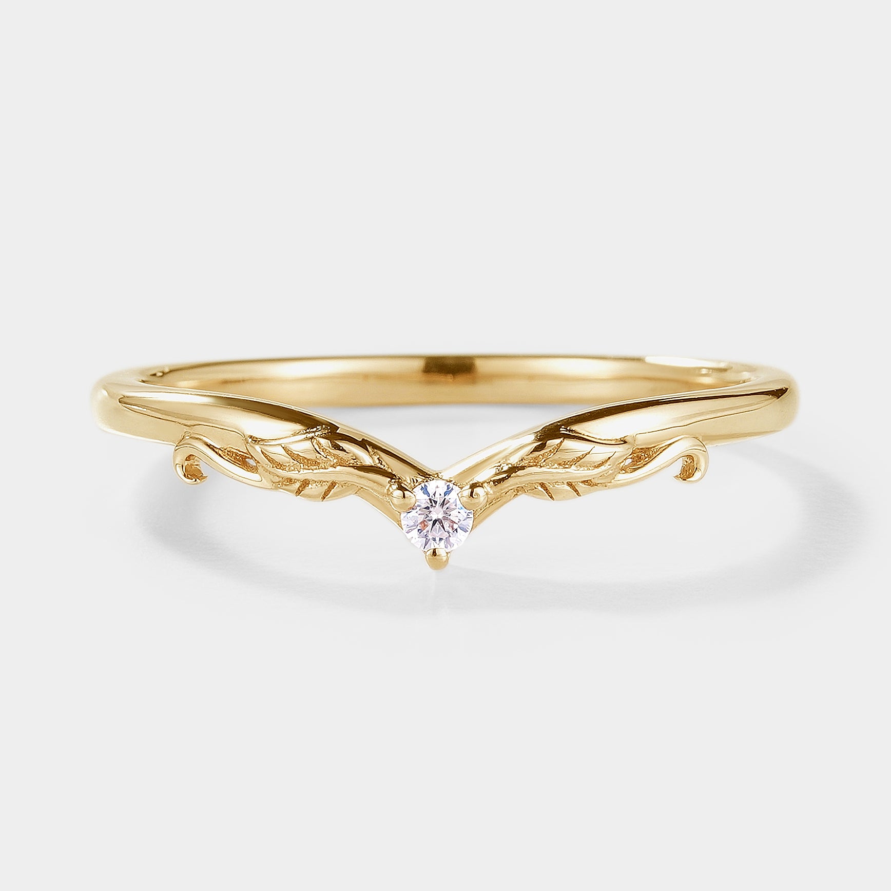 Yellow gold V-shaped moissanite wedding band with leaf design