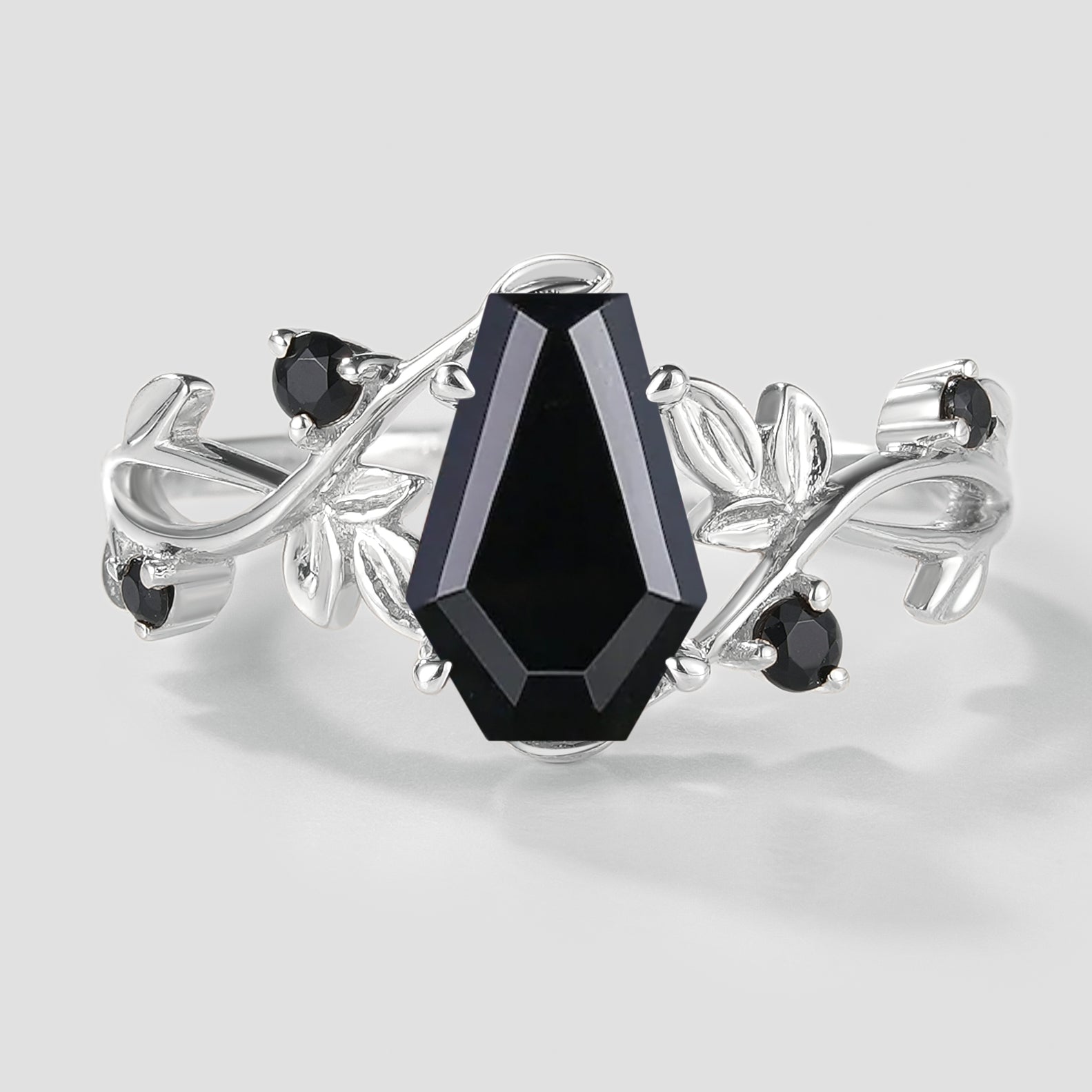 Black onyx coffin cut engagement ring with leaf detail