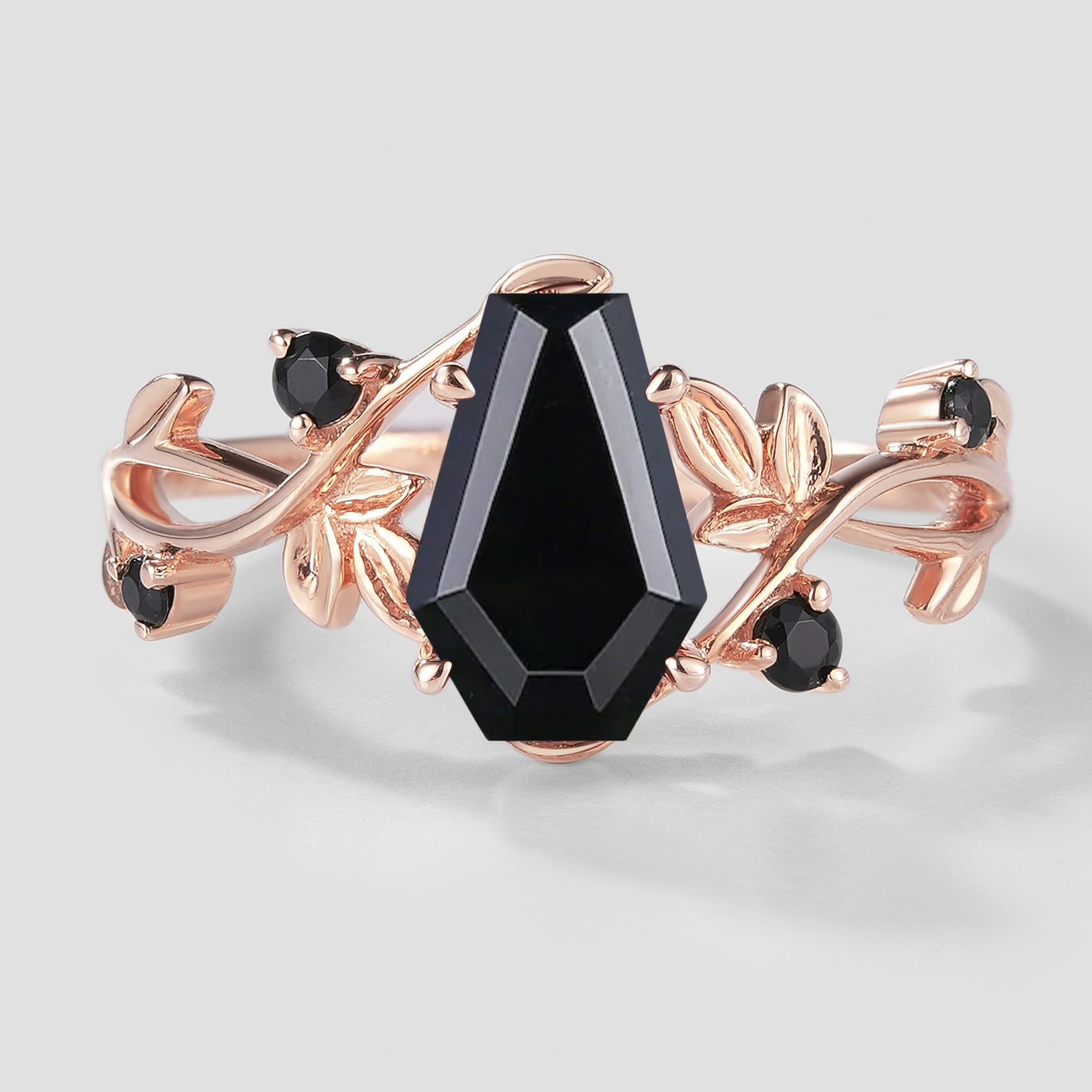 Black onyx coffin cut engagement ring with leaf design