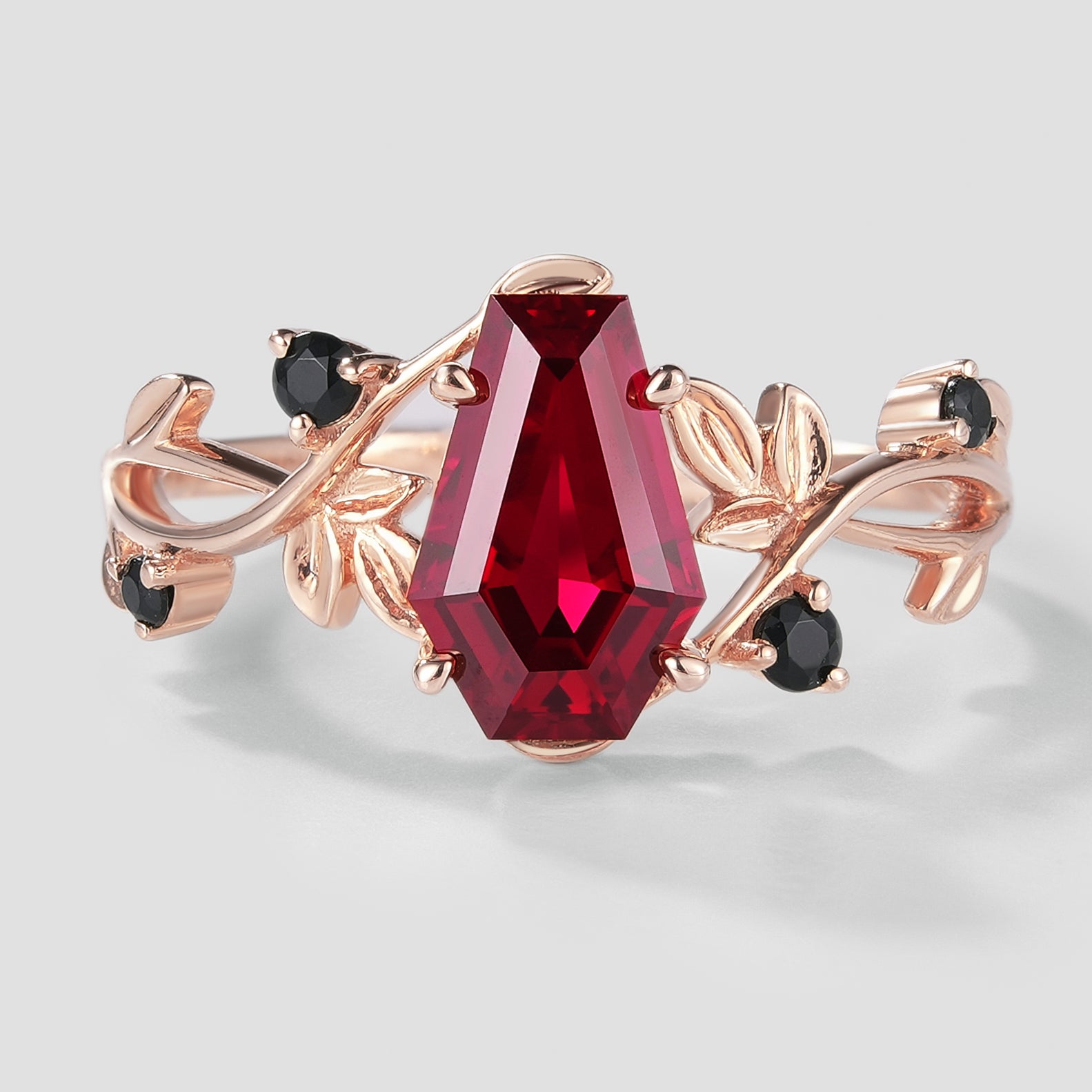 Rose gold coffin cut ruby ring with leaf accents