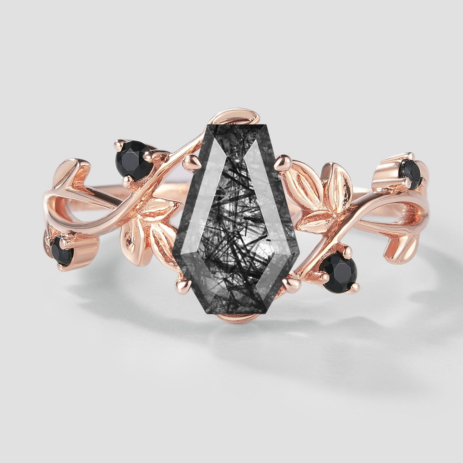 Rose gold leaf engagement ring with black rutilated quartz