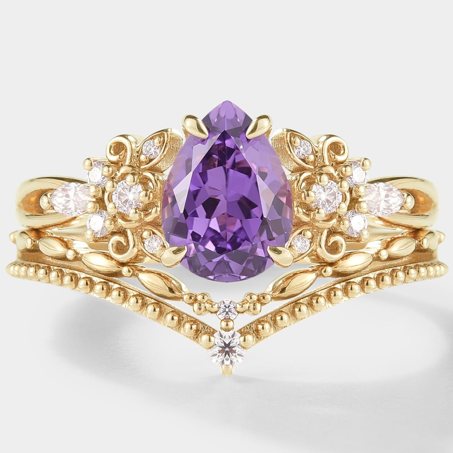 Nature-inspired purple sapphire engagement ring set