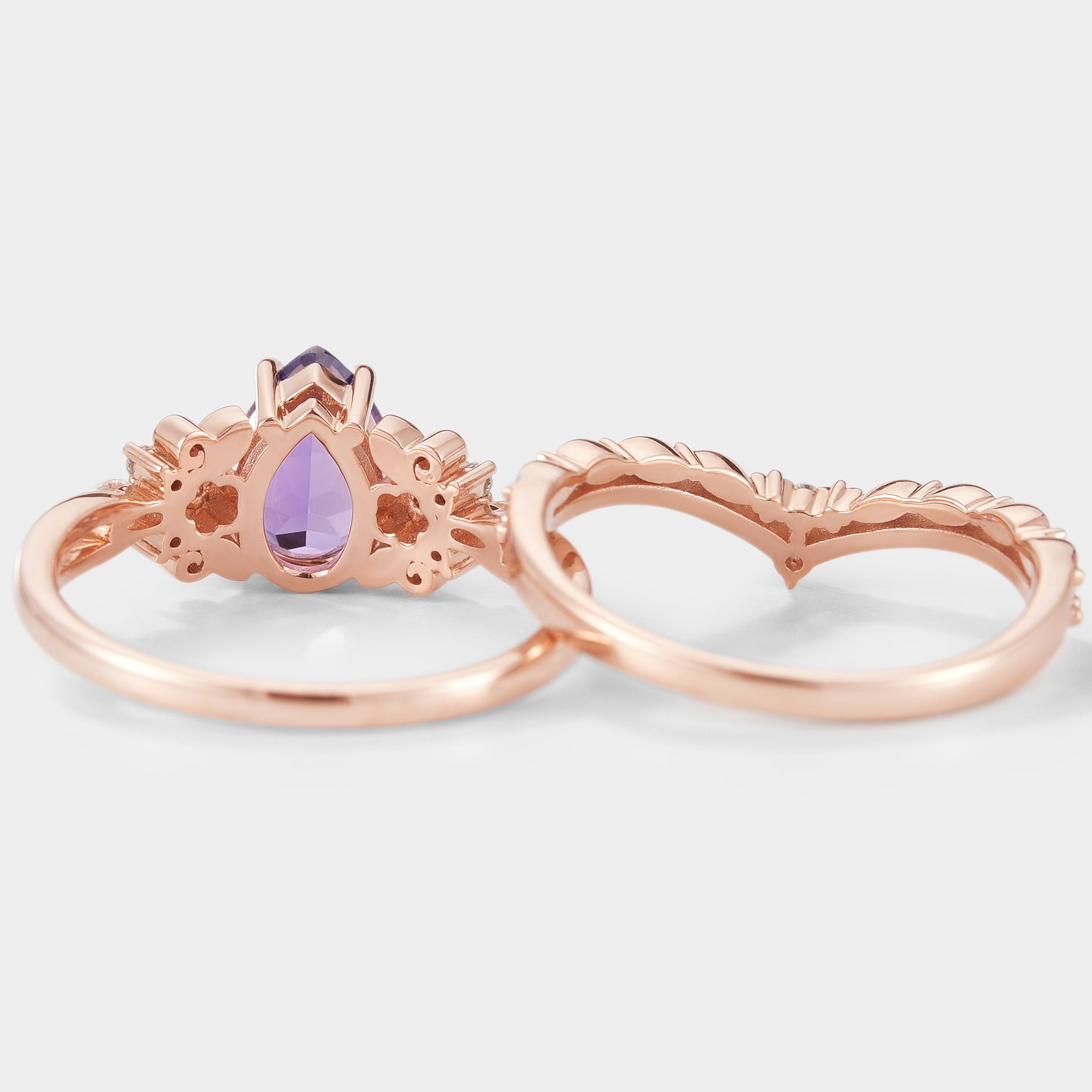 Rose gold pear cut purple sapphire engagement ring set with floral details