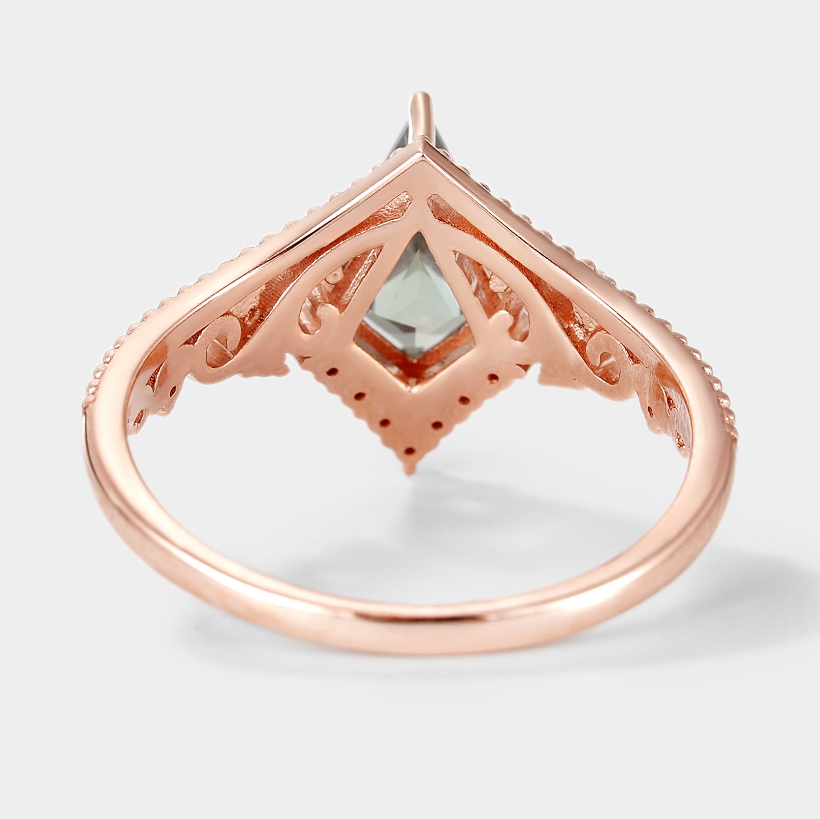 Rose gold kite cut lab green sapphire engagement ring